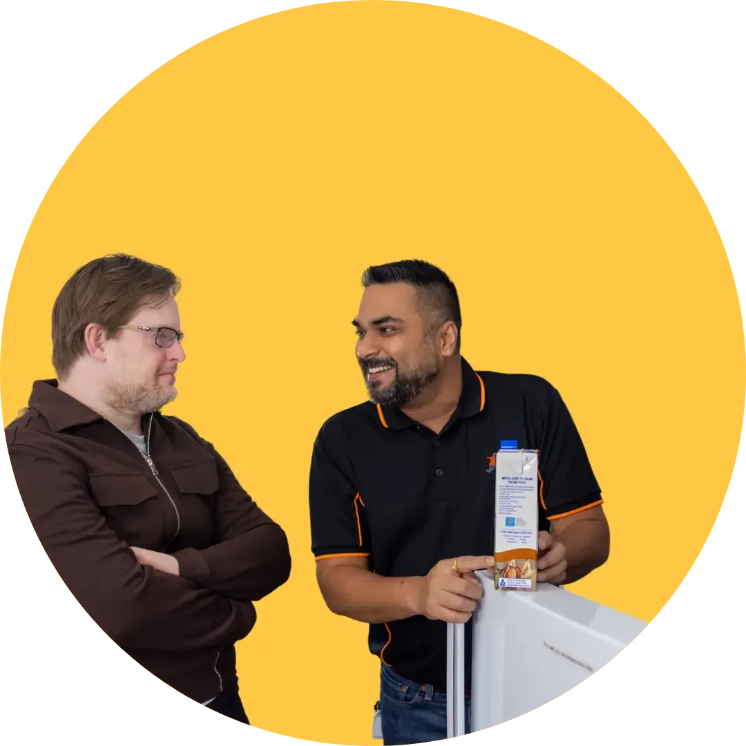 Support worker explaining task to participant in friendly work environment