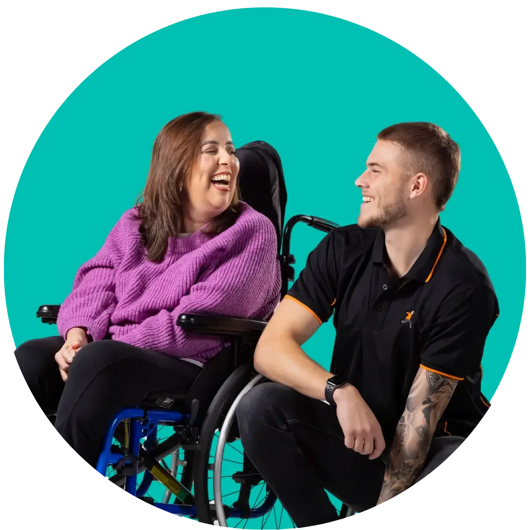 Person using a wheelchair laughing with an ONCALL support worker