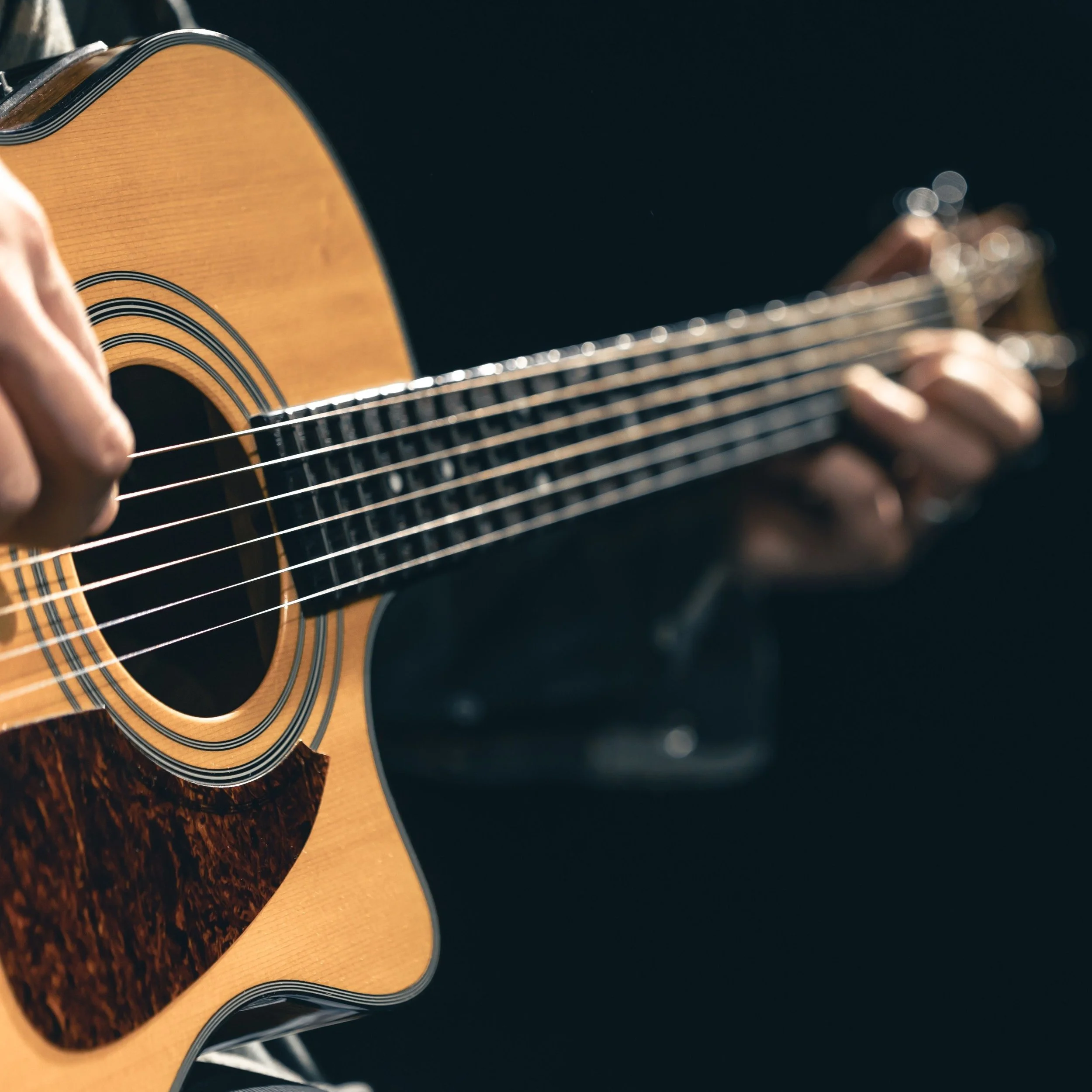 male-musician-playing-acoustic-guitar-microphone-recording-studio_96_DPI_100x100.jpg