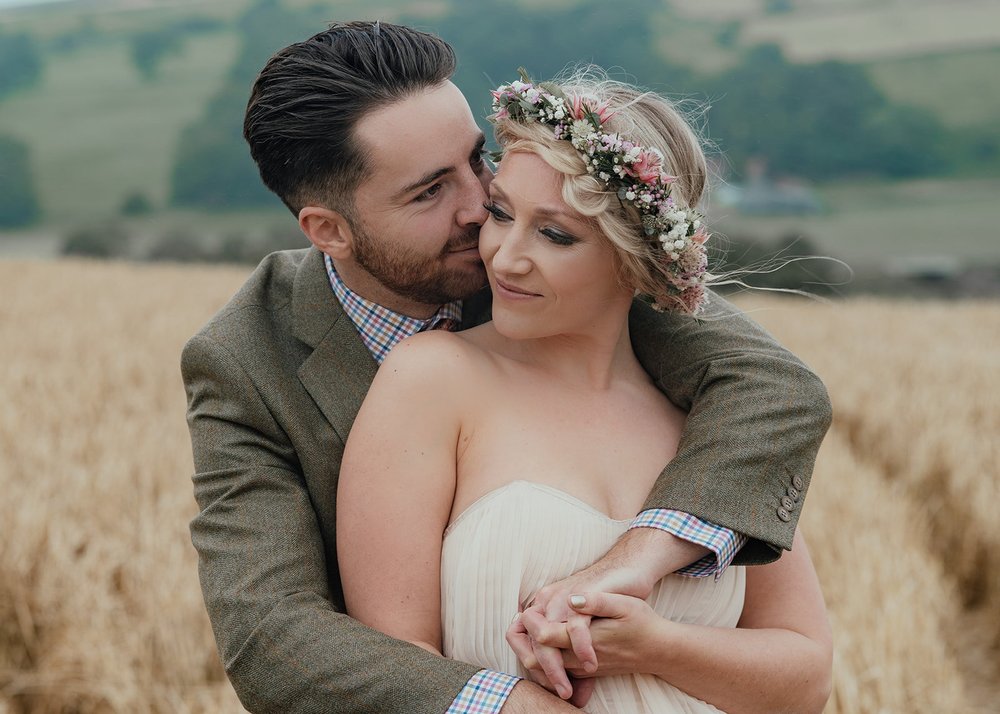 bride and groom in cornfield with flower crown