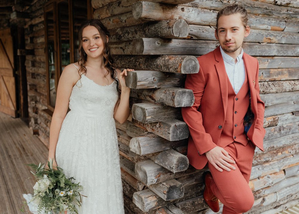 first look wedding photo idea with groom in rust coloured suit