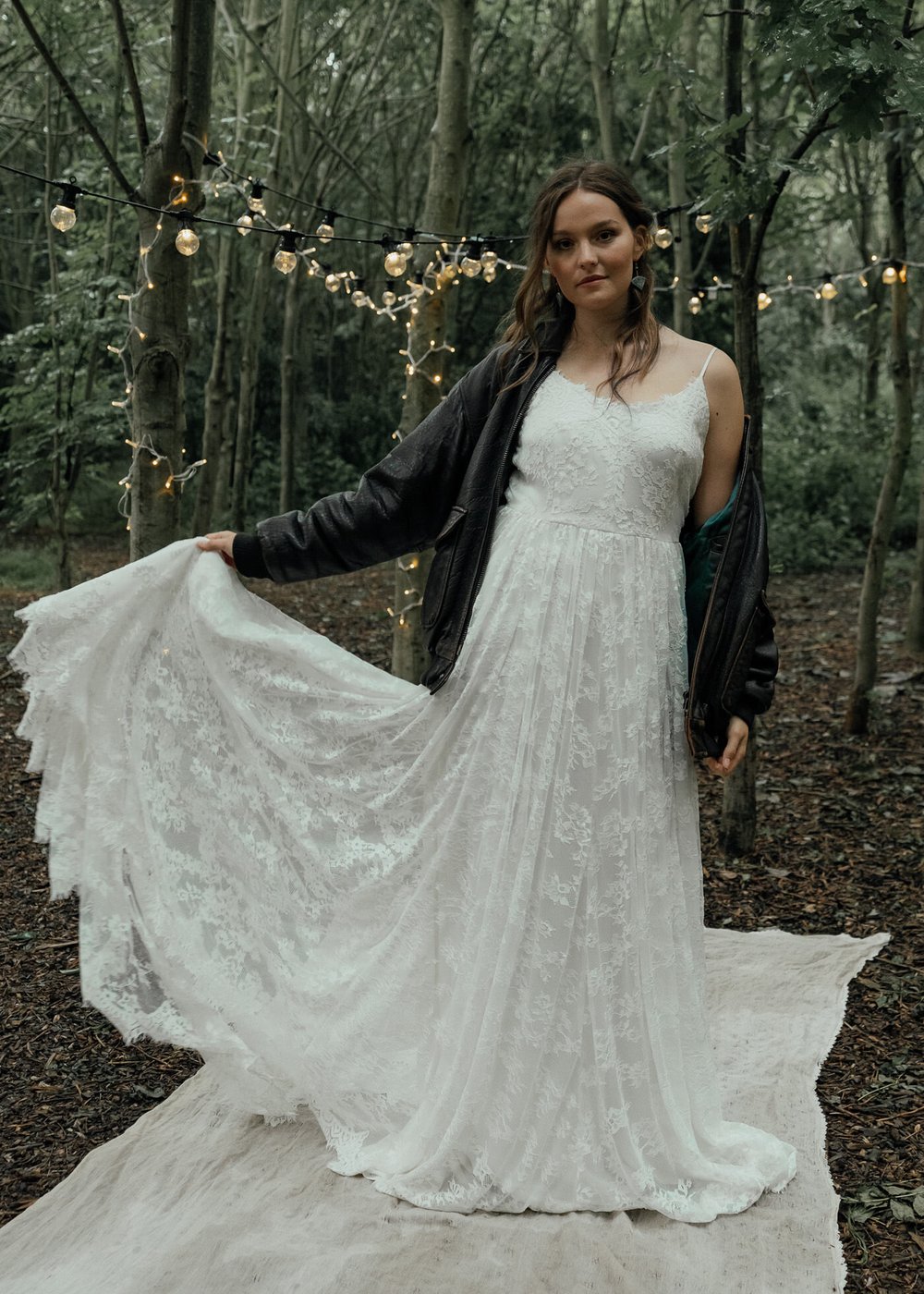 bride wearing chantel lauren wedding dress and leather jacket