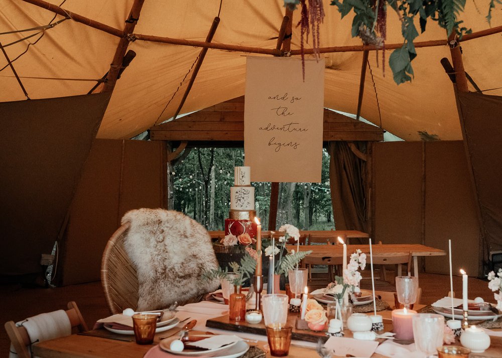 nordic styled boho tipi interior for wedding with fur throws and candles