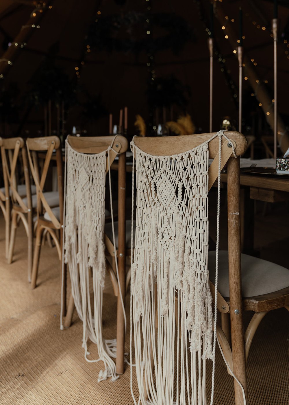 macrame bride and groom chair covers in tipi with wooden chairs