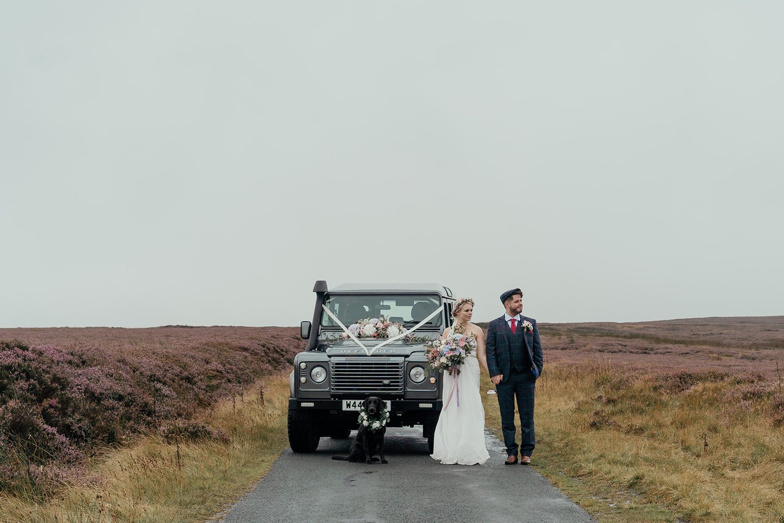 heather covered north york moors with defender wedding car