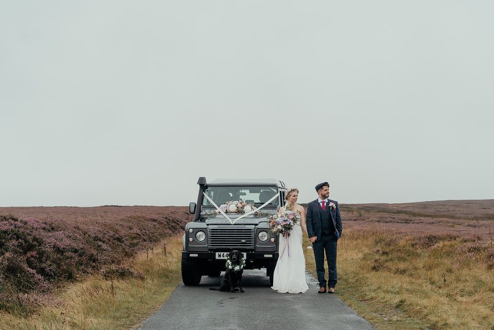 heather covered north york moors with defender wedding car