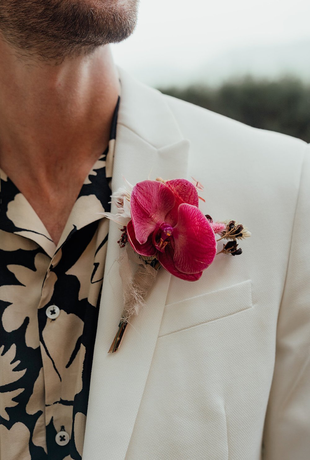 bright pink orchid buttonhole