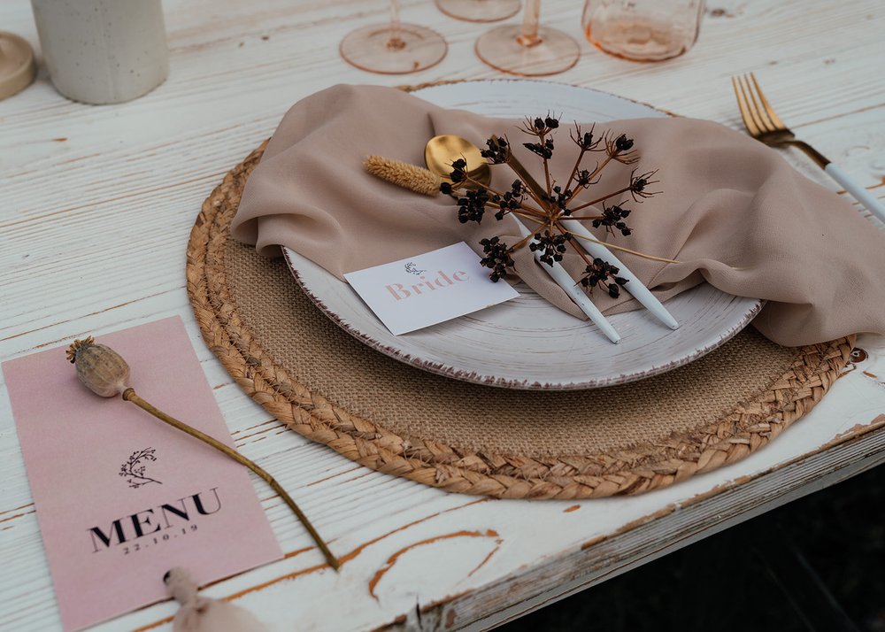 delicate pink and neutral wedding table setting