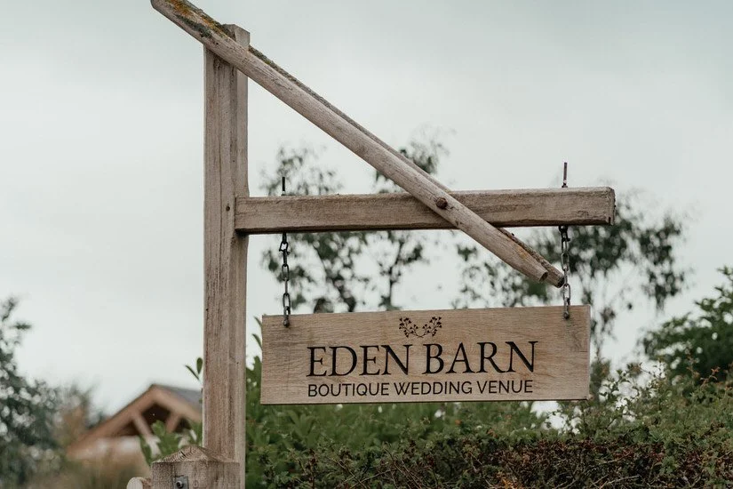 swinging eden barn boutique wedding venue entrance sign