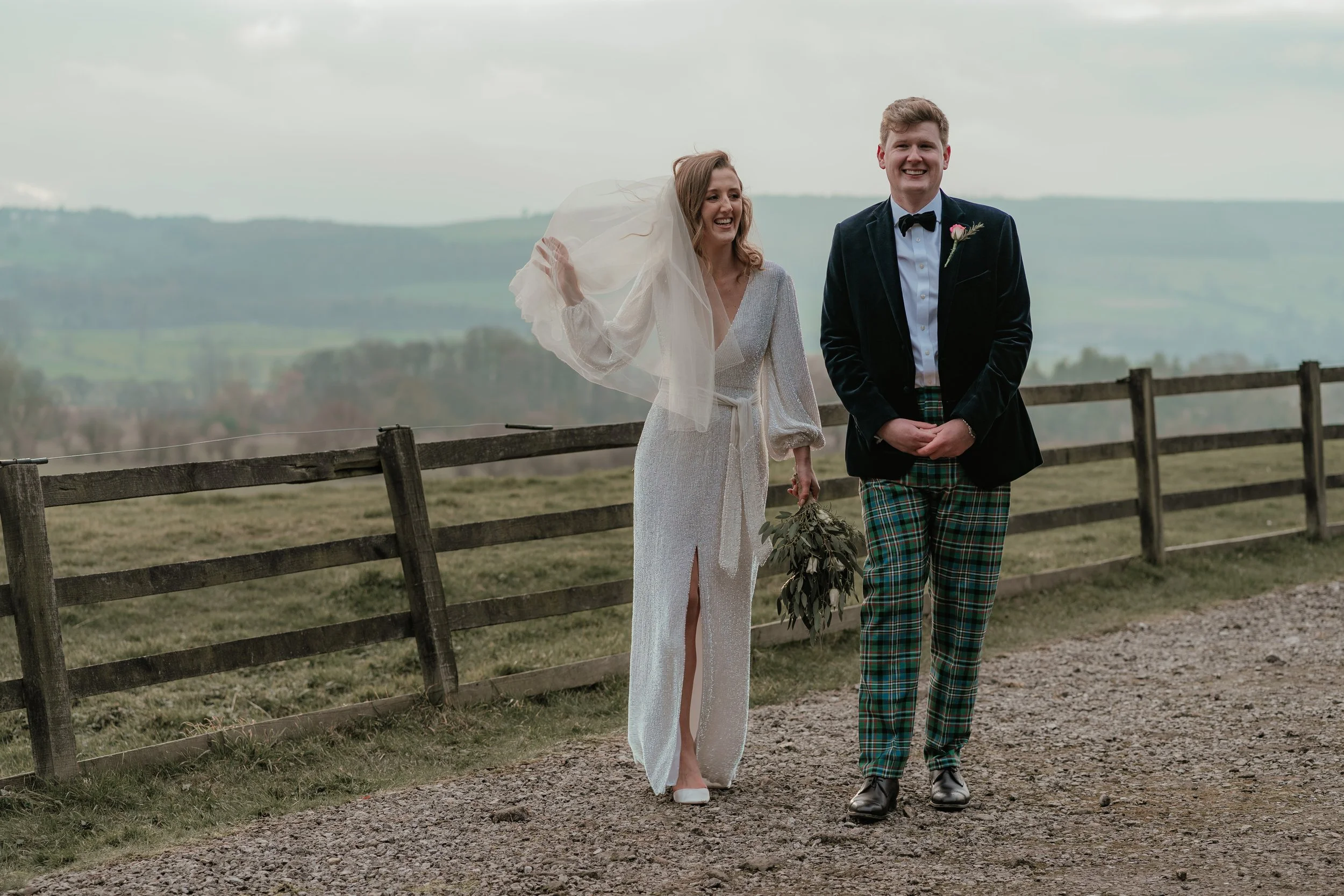 bride and groom just married with the yorkshire dales as a backdrop