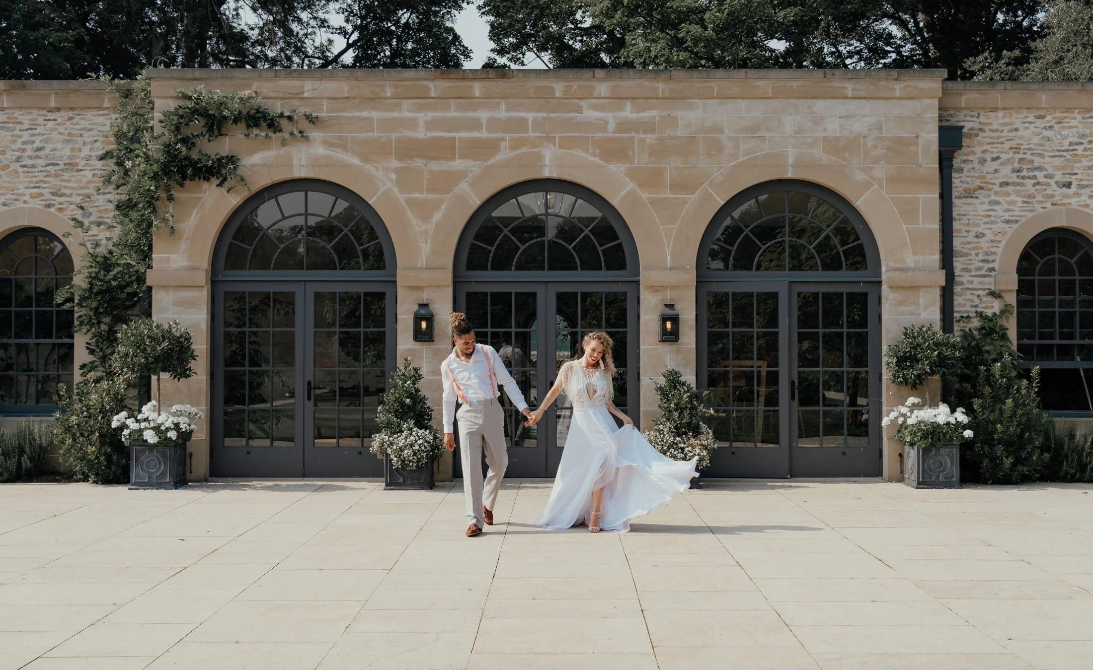 wedding bride and groom outside the fig house at middleton lodge wedding venue