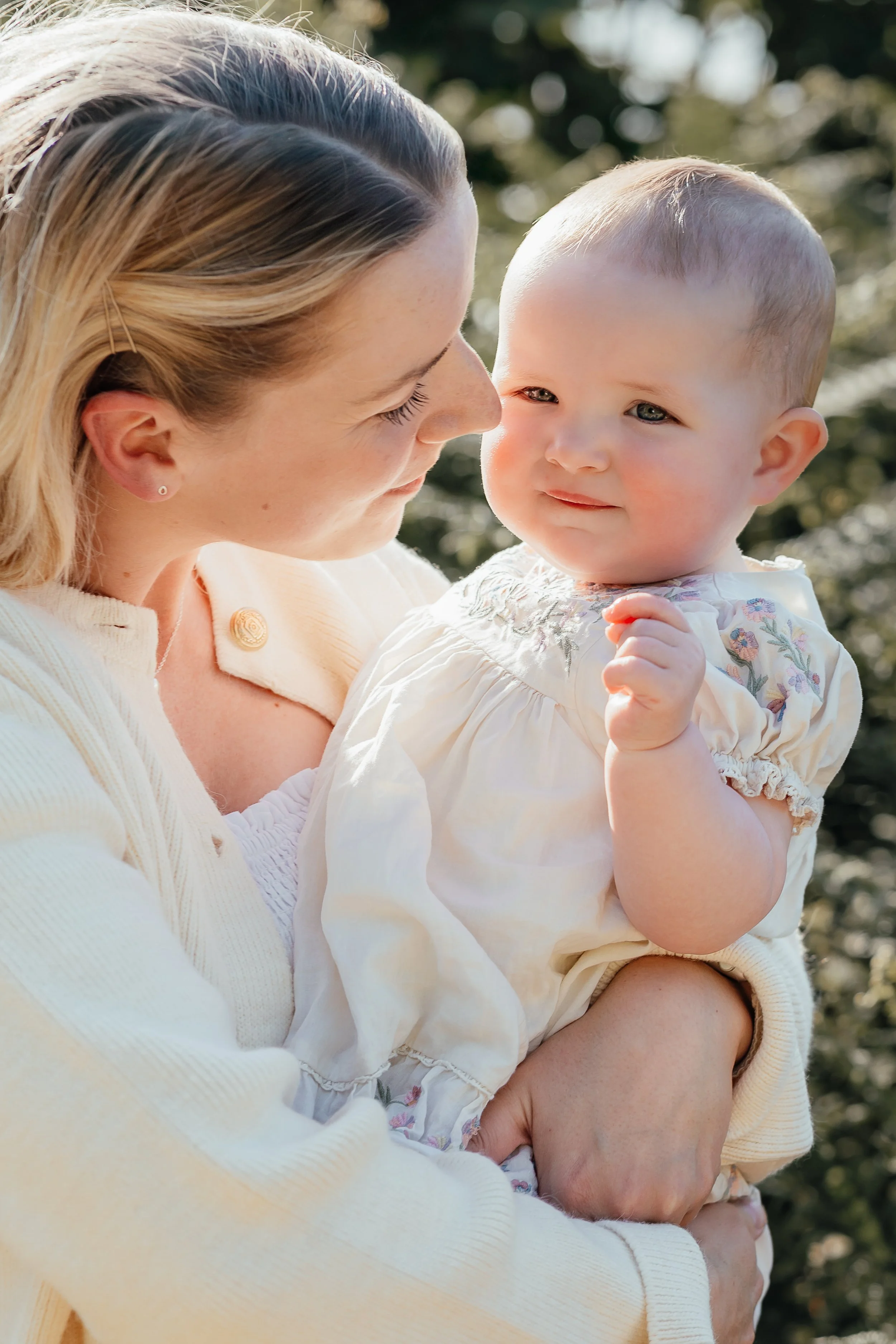 mother with baby in neutral clothing