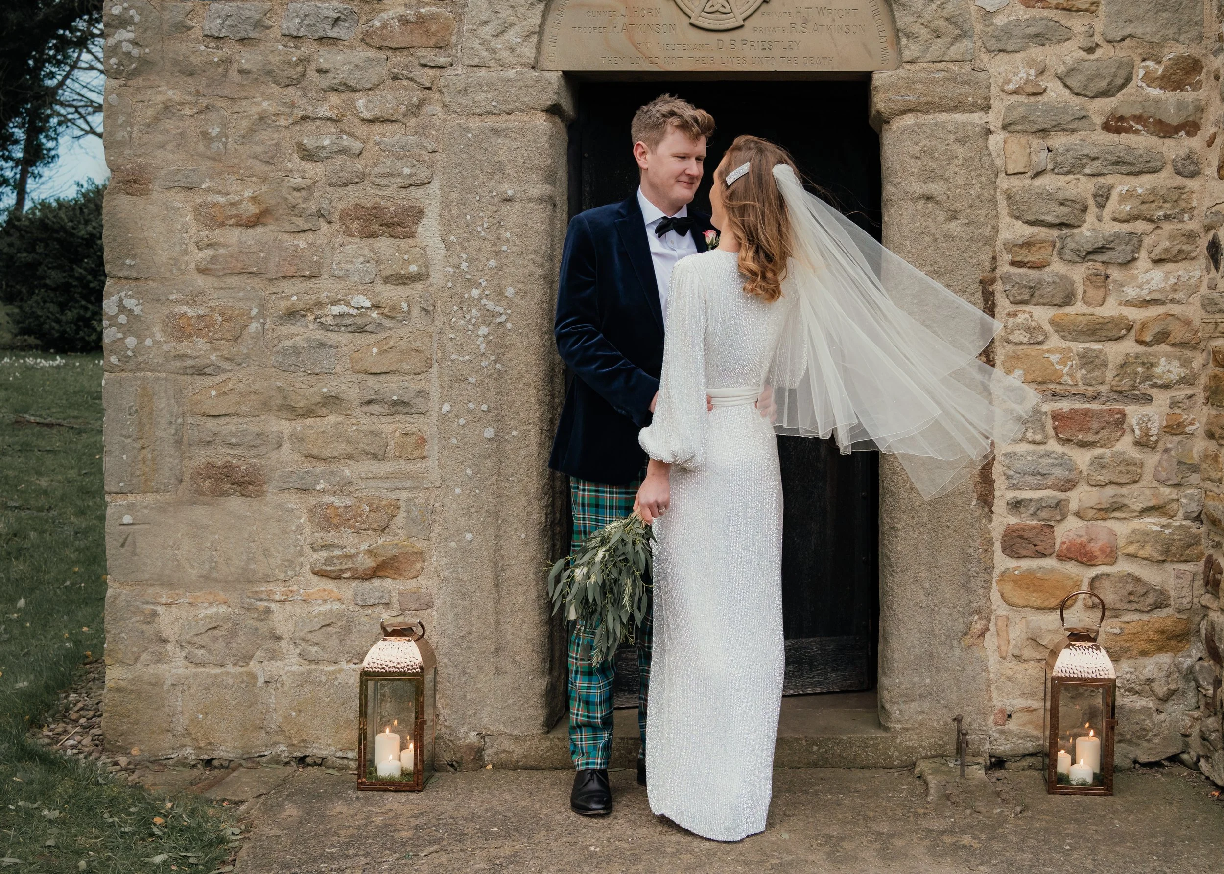 bride and groom just married outside the entrance to a Yorkshire chapel