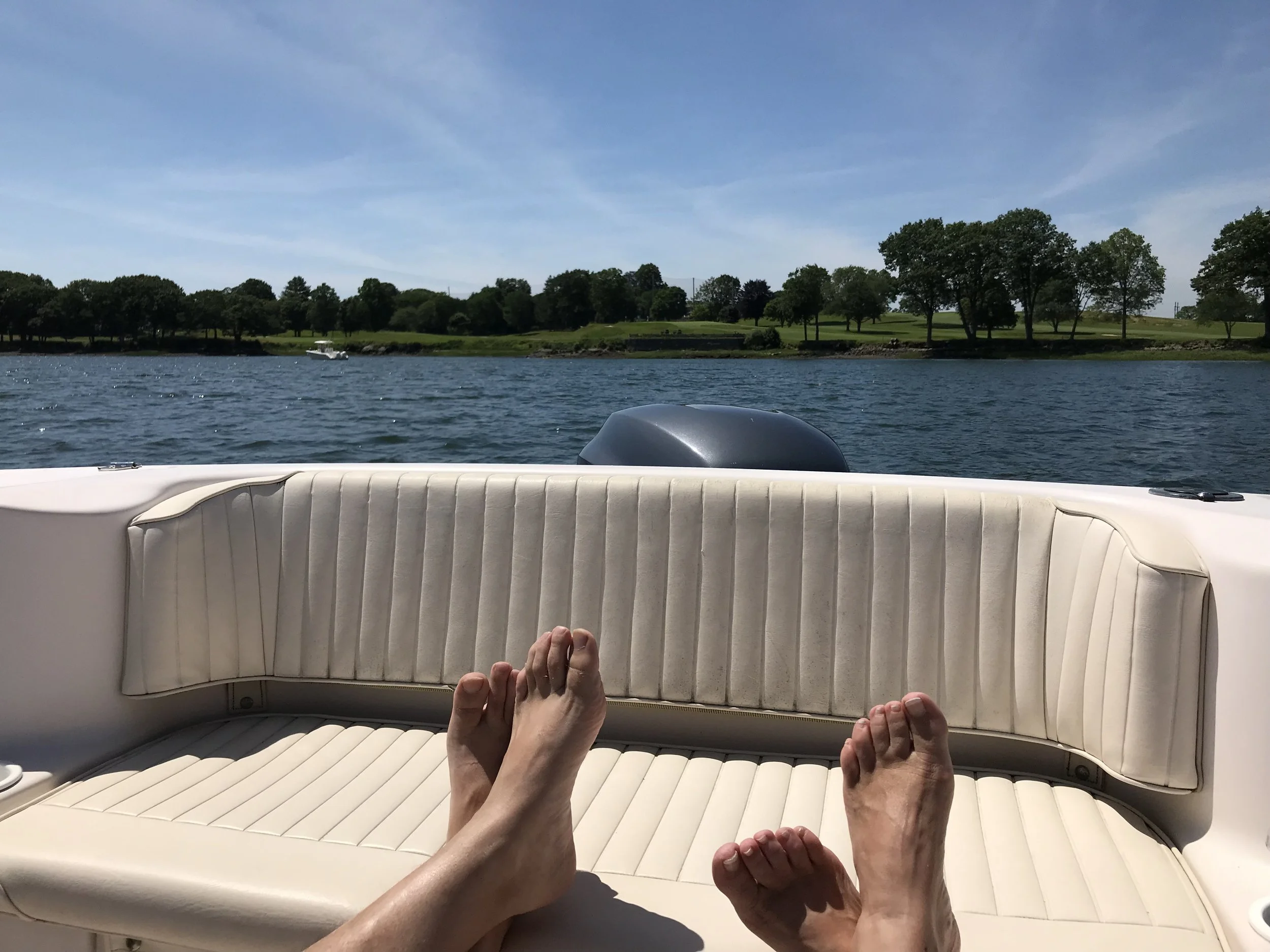 2019070506485906-IMG_2929 relaxing on boat with feet on cushion.jpeg
