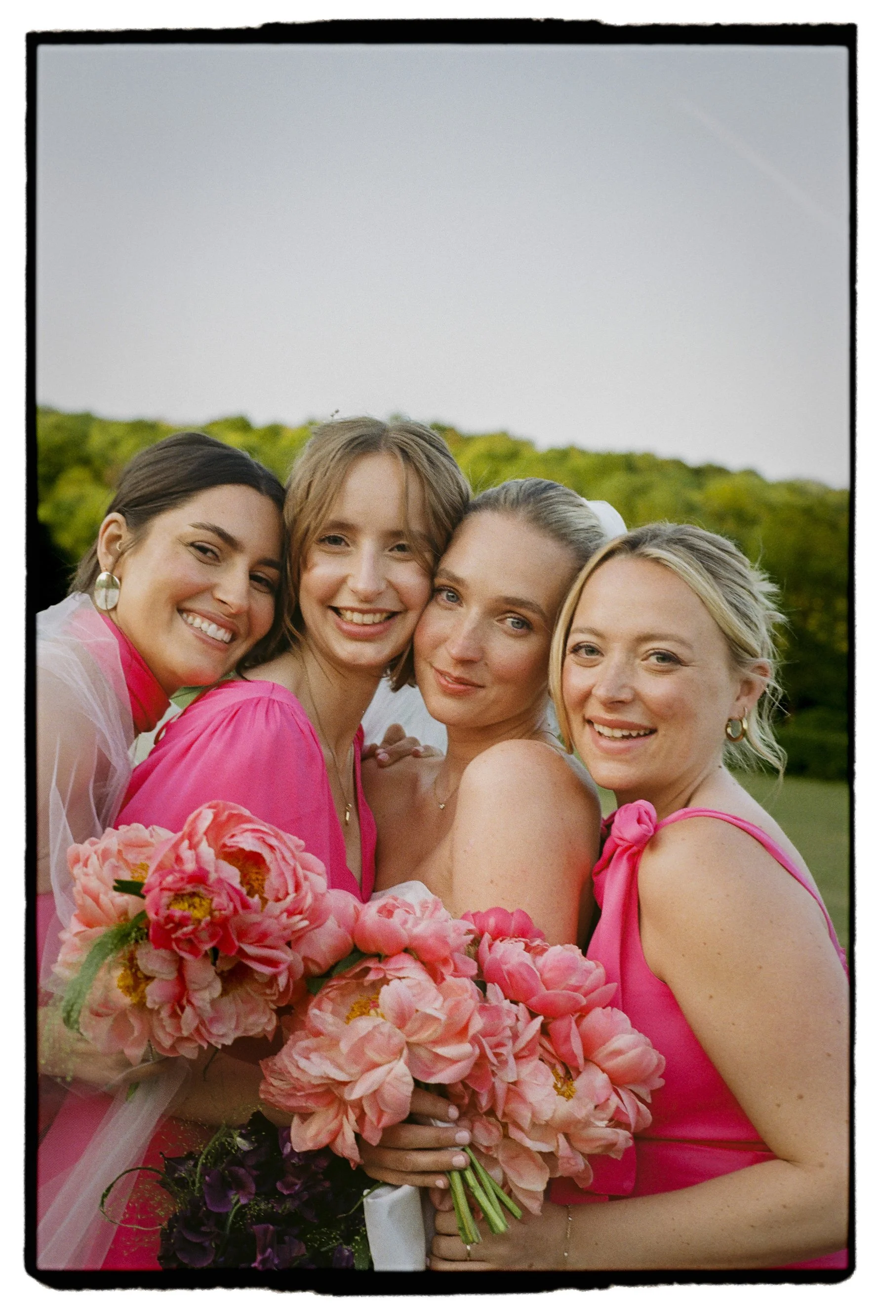 bridesmaids posing together shot on 35mm film