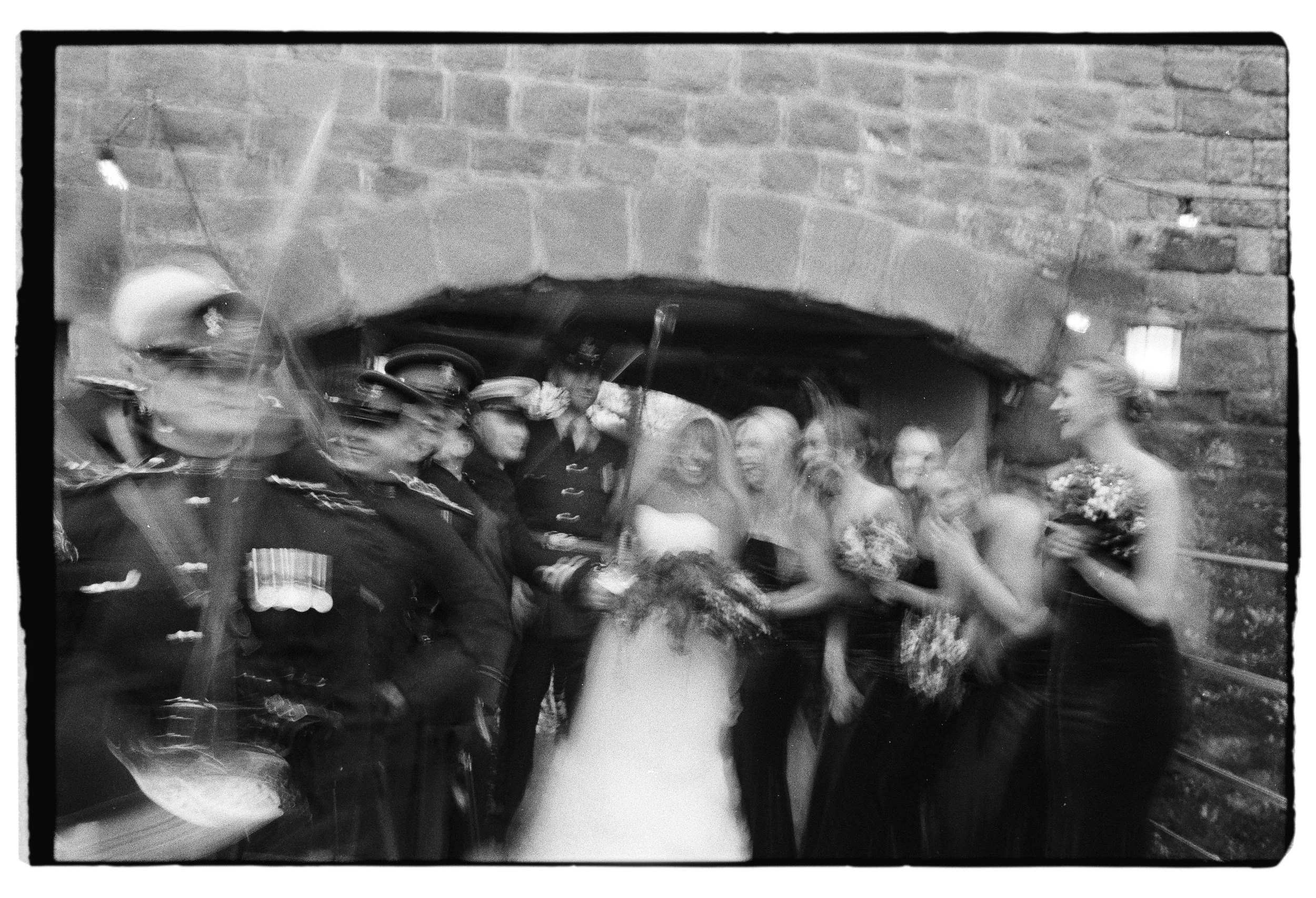 blurry wedding group shot on black and white 35mm film grainy