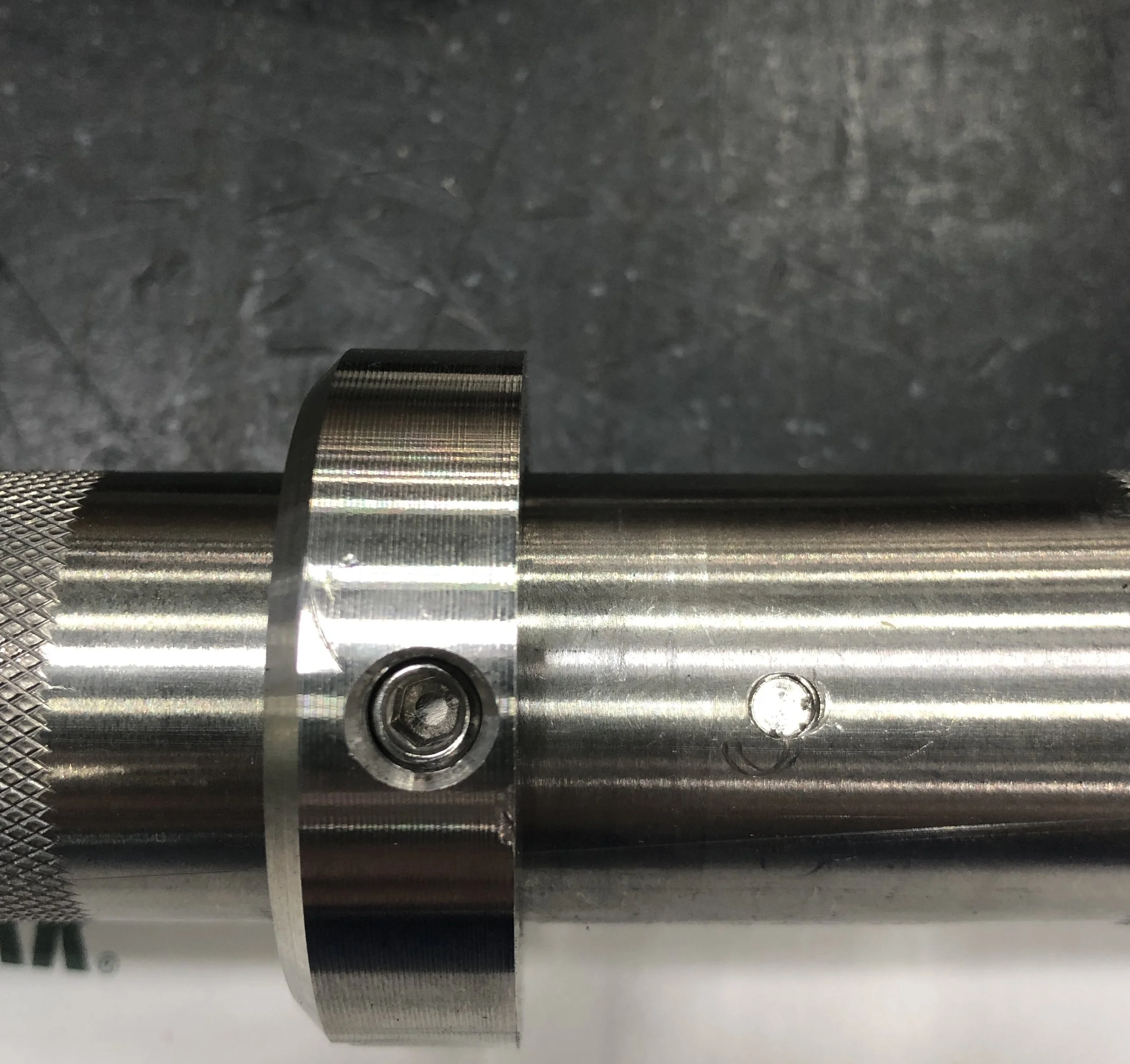 Added a set screw hole to fasten the set screws. In addition, this helped with assembly time and accuracy of the shaft collar placement. 