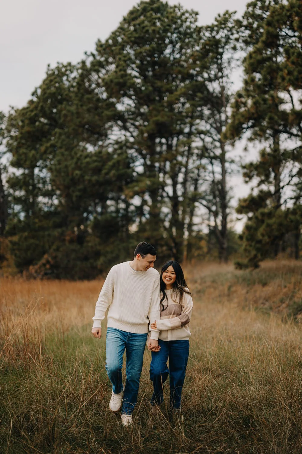 4. Couple standing together in open field engagement photos