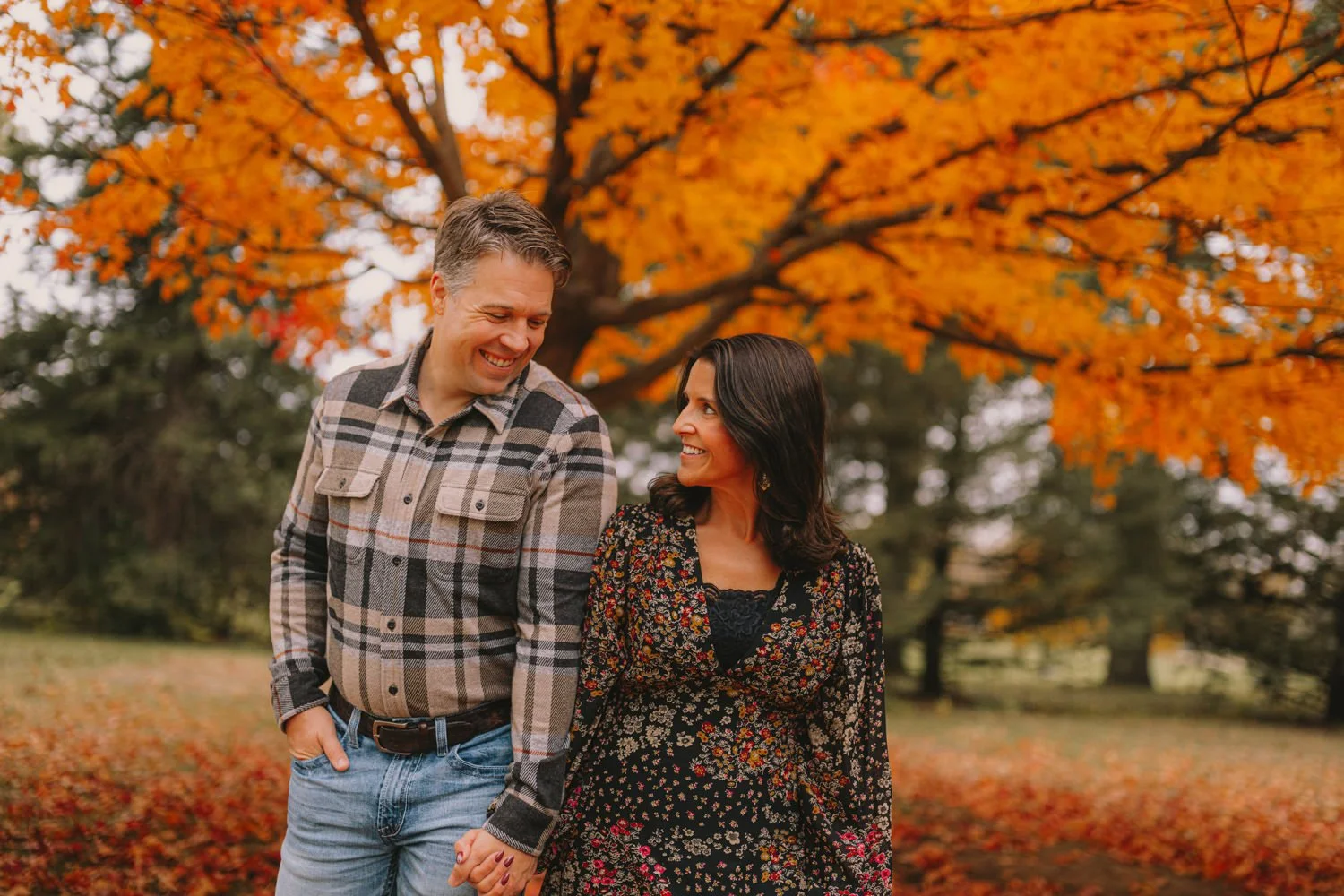 Cookman family walking together at Pioneers Park in fall