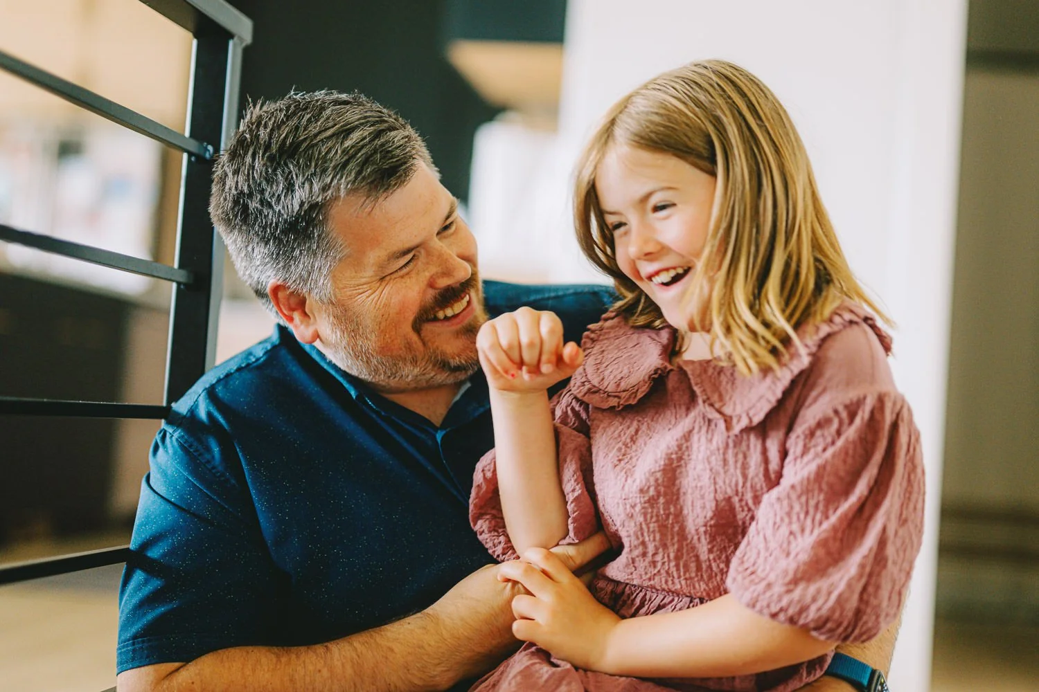 Authentic family moments, both indoors and outside, captured naturally in Lincoln.