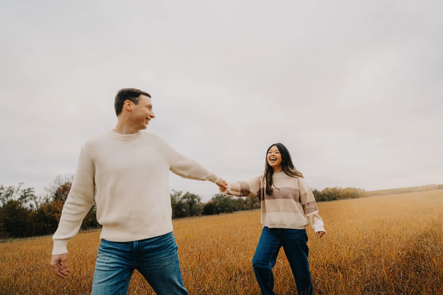 2. Couple laughing together during engagement photos