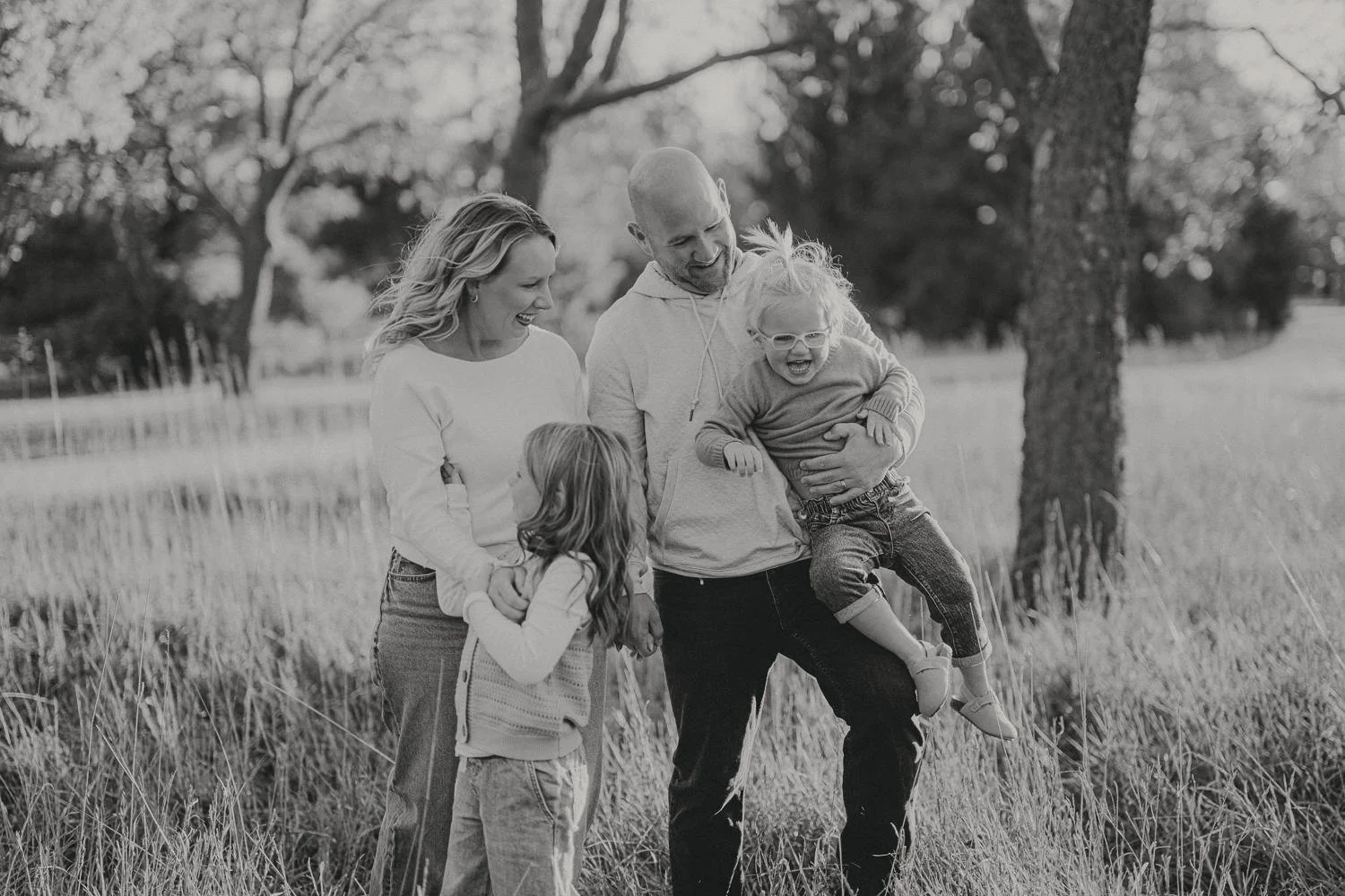 Family laughing together outdoors