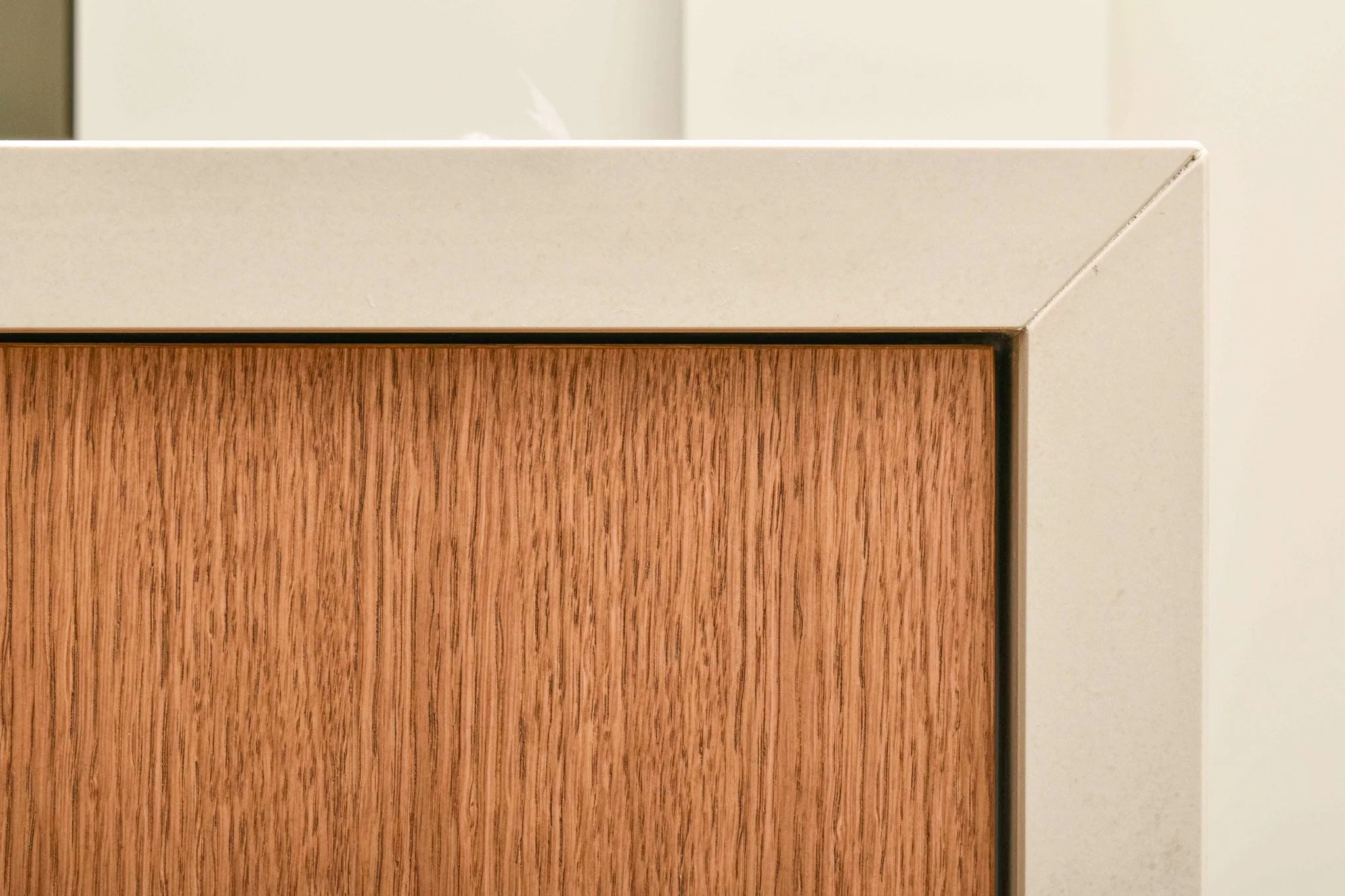 A binder filled with sample tiles of various types of granite and stone, each labeled and displayed in clear plastic sleeves for selection or comparison.