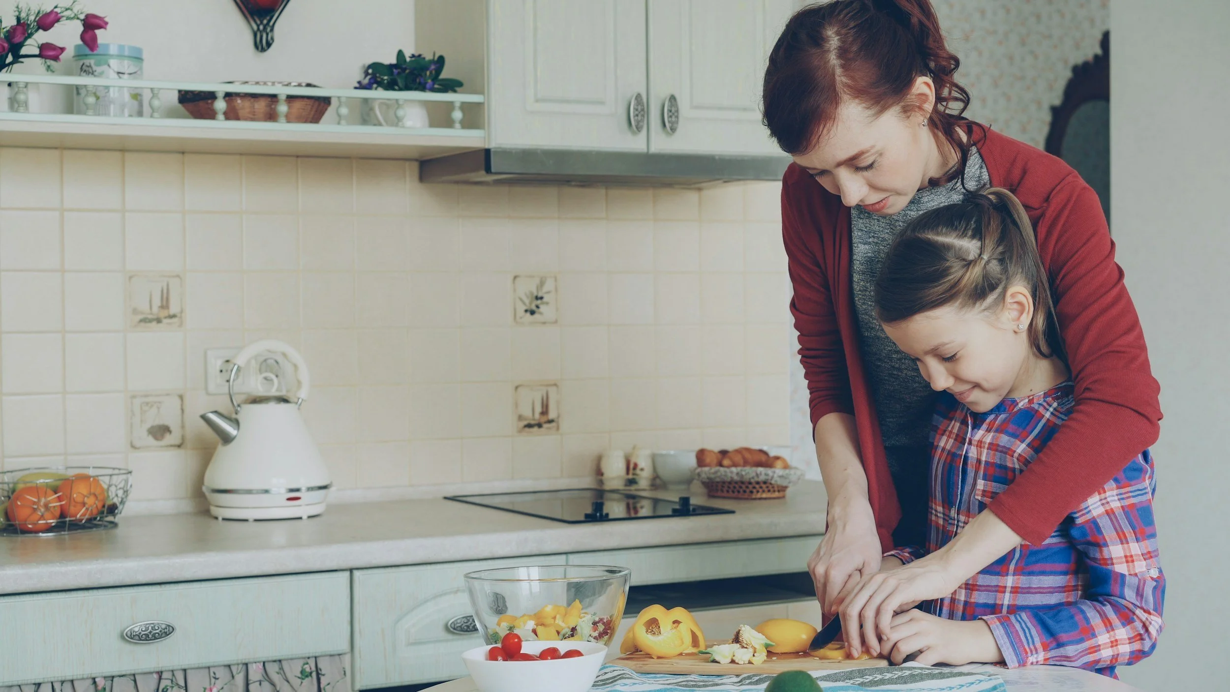 child getting help with cooking