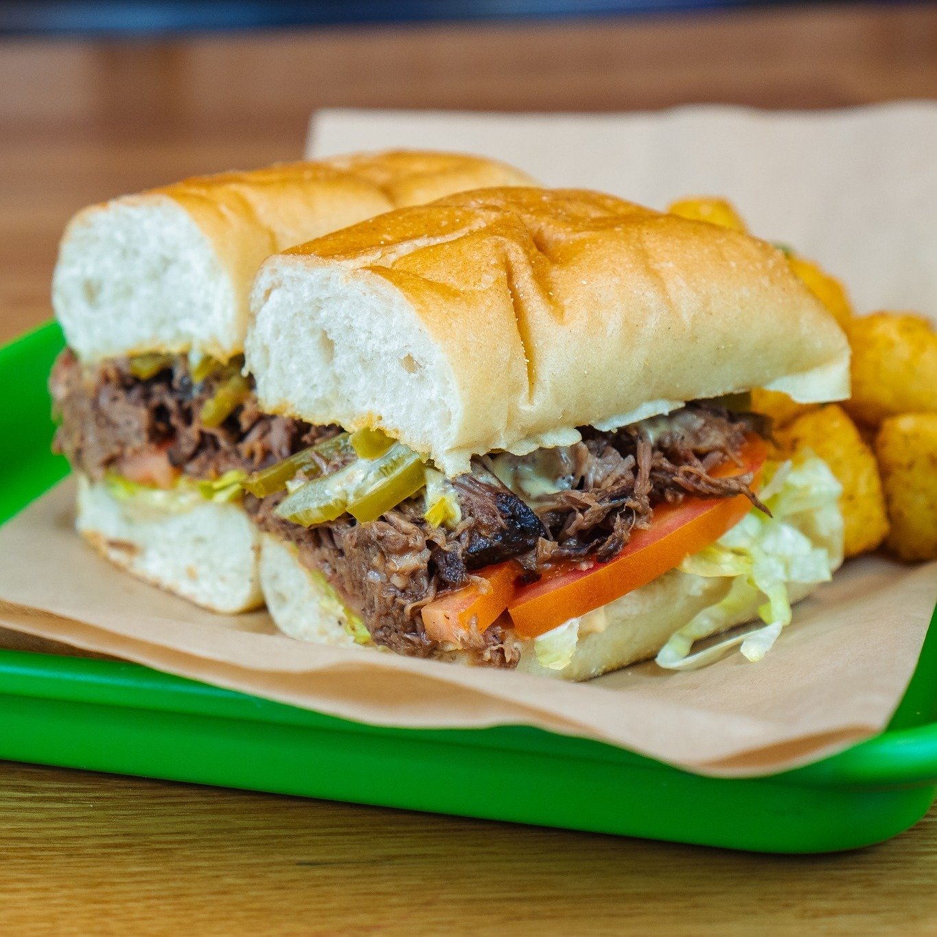 It's A Torta! 🥪 🔥  Start with your protein of choice, layer on that crispy shredded lettuce, zesty garlic mayo, juicy tomato, and tangy pickled peppers. And why stop there? Elevate your meal with a side of golden tots for just $2 extra! 😋👌

Don't