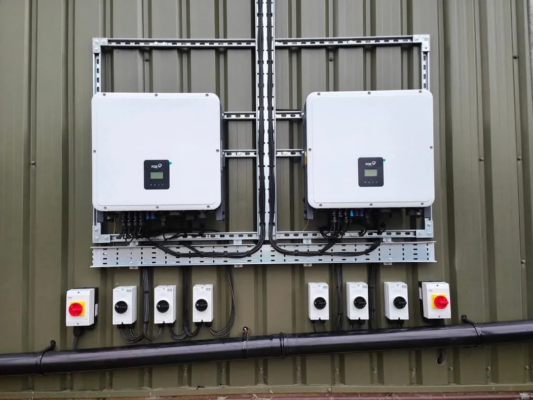 Electrical control panels mounted on a wall with switches and wiring.