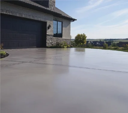 Clean, durable concrete garage floor with a closed garage door, highlighting professional garage flooring services in Columbus