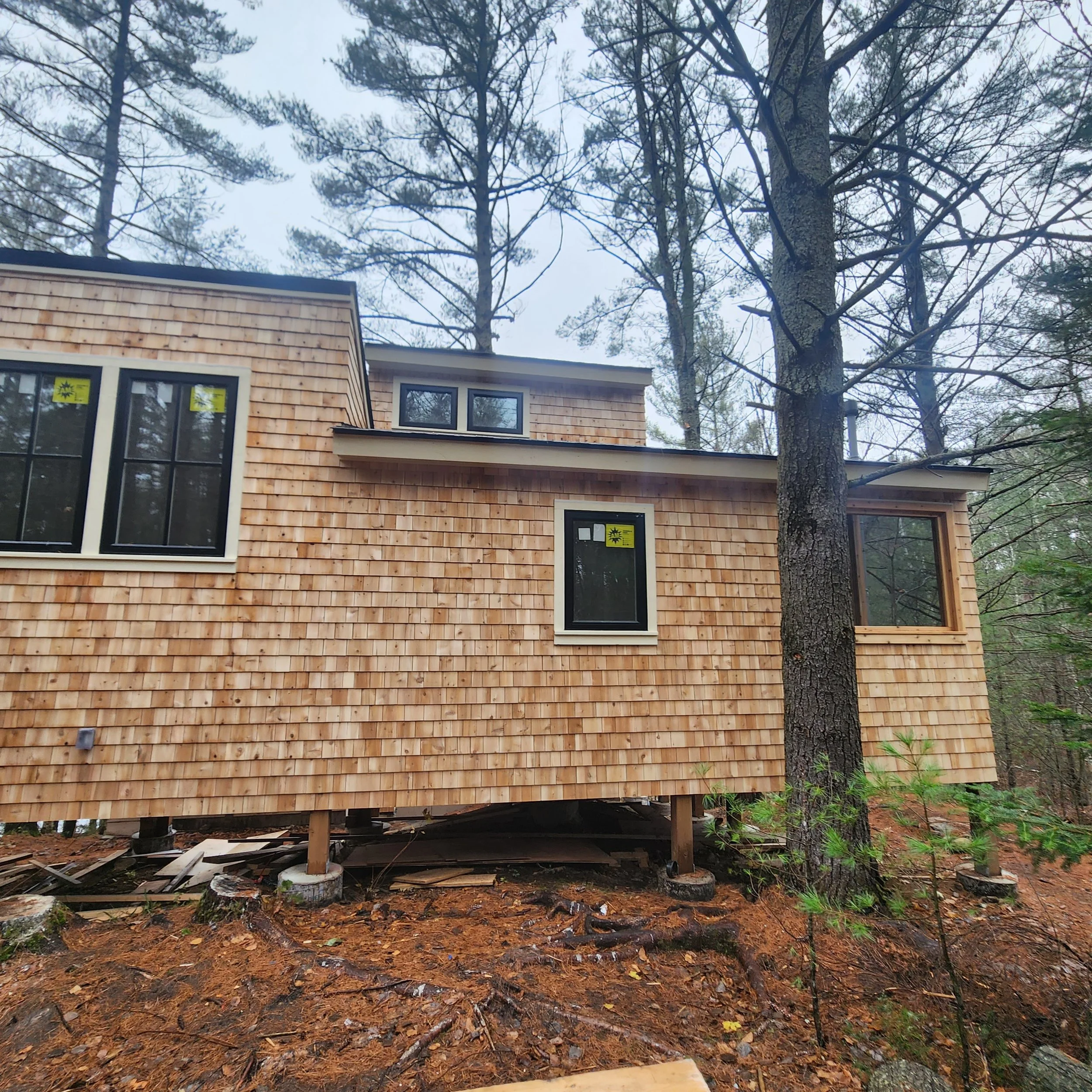 ground-up-constructing-muskoka-cottage-build-phase-1-front-exterior.jpg