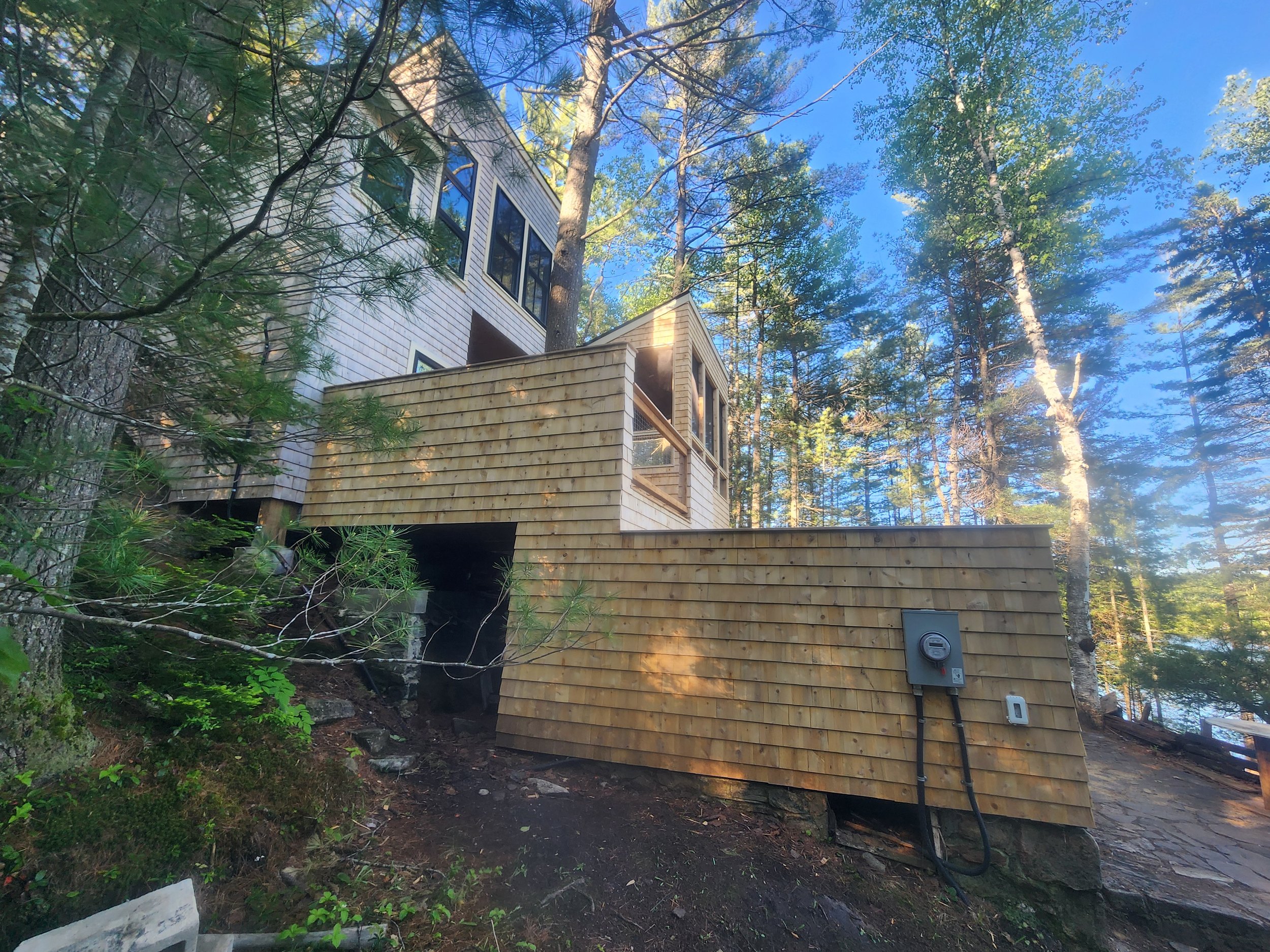 ground-up-constructing-muskoka-cottage-cedar-shingle-deck-exterior.jpg