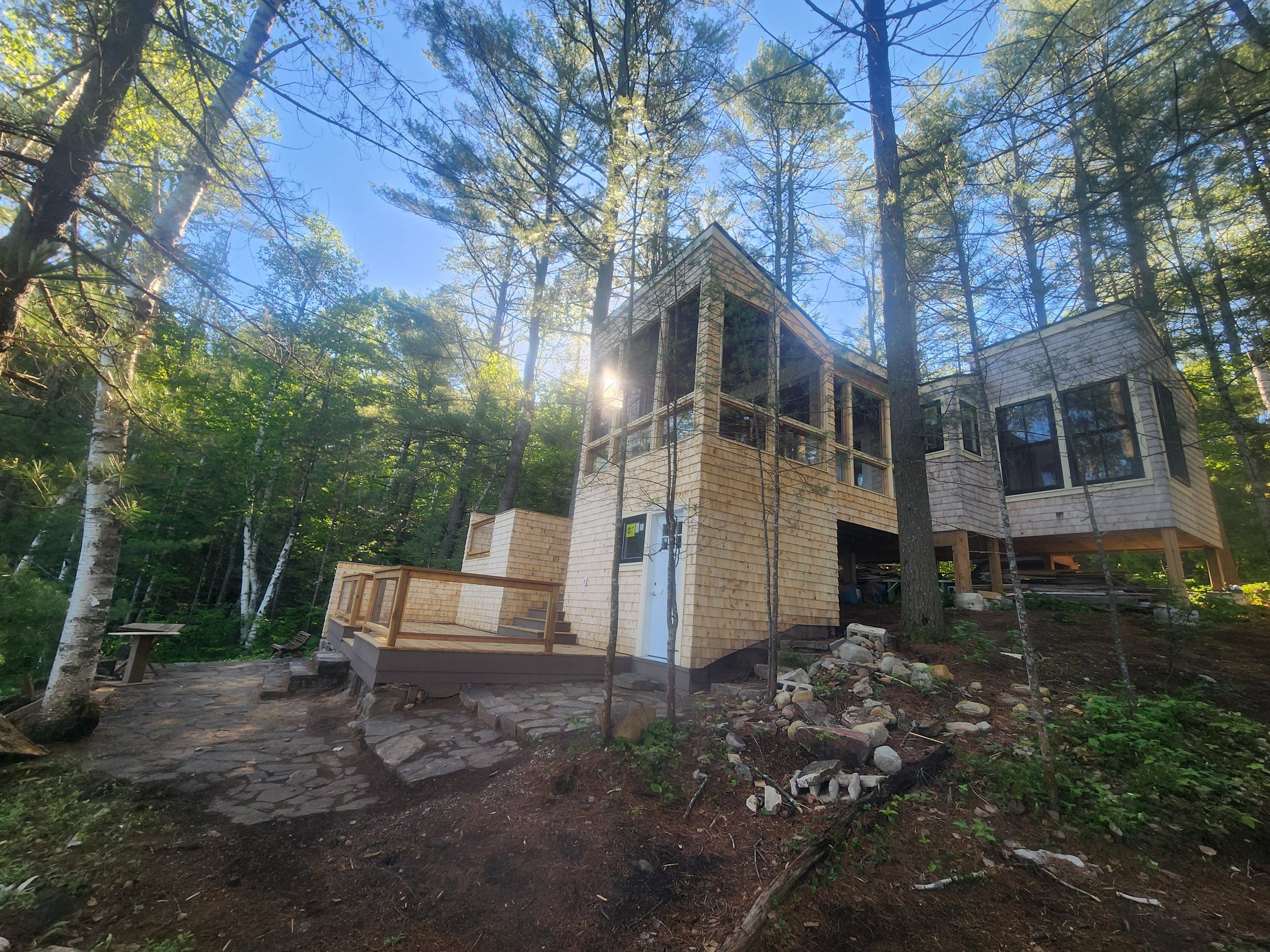 ground-up-constructing-muskoka-cottage-exterior-forest-view.jpg