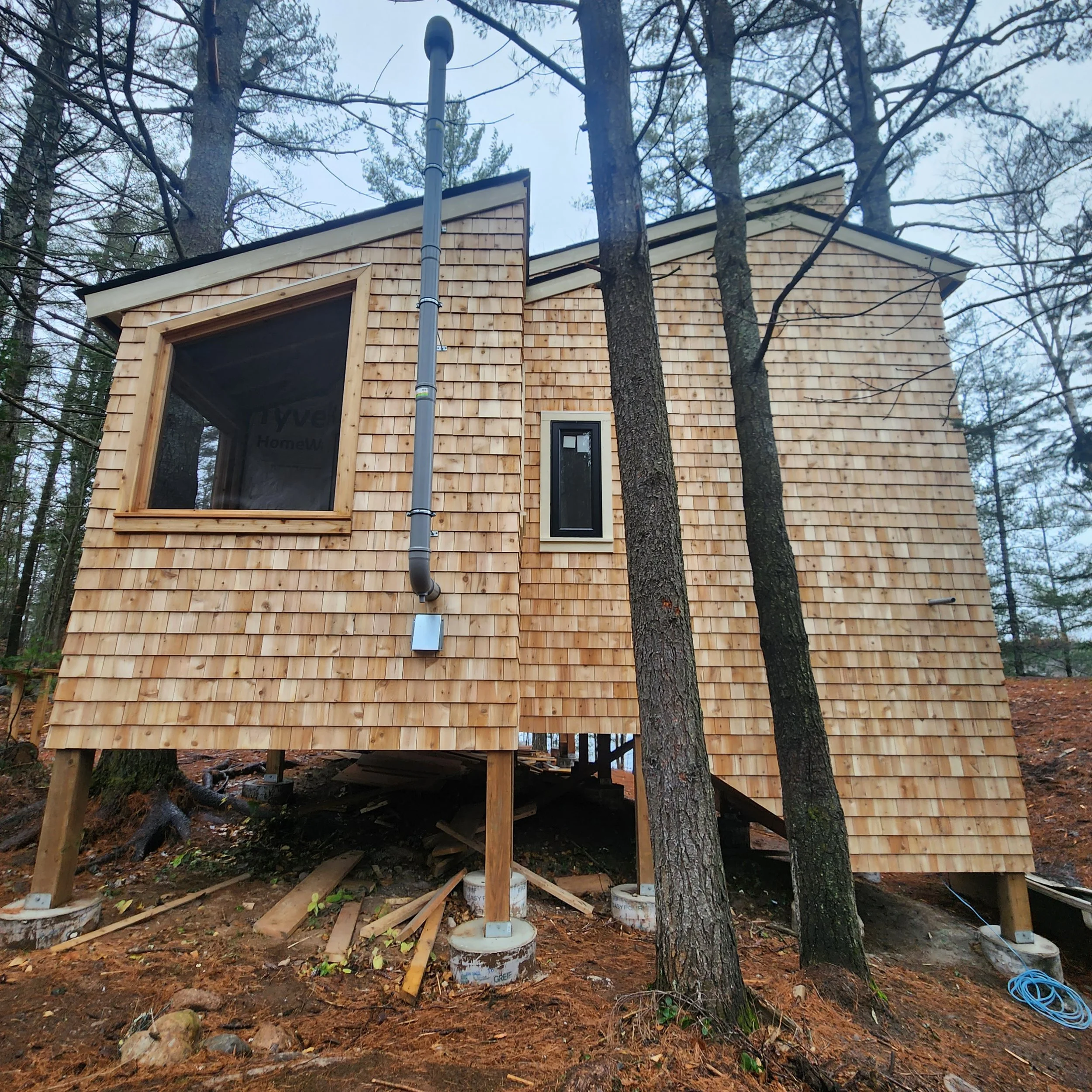 custom-cottage-build-cedar-shingle-siding-elevated-foundation-baysville-muskoka.jpg