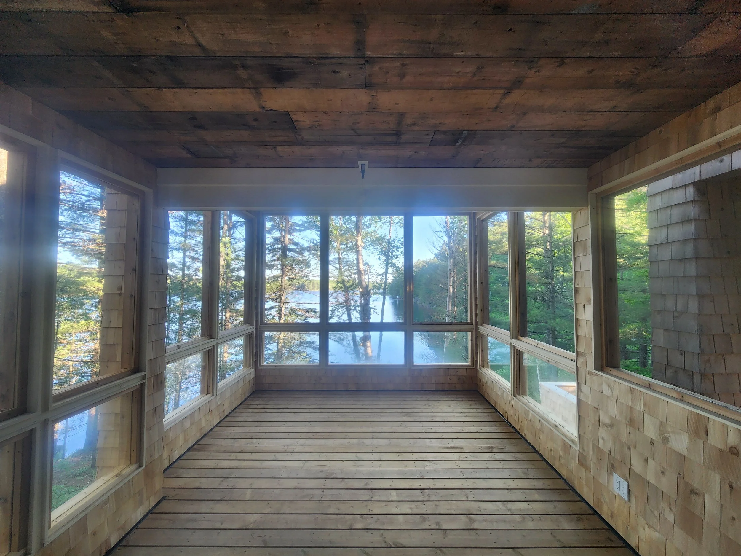 ground-up-constructing-muskoka-room-interior-lake-view.jpg
