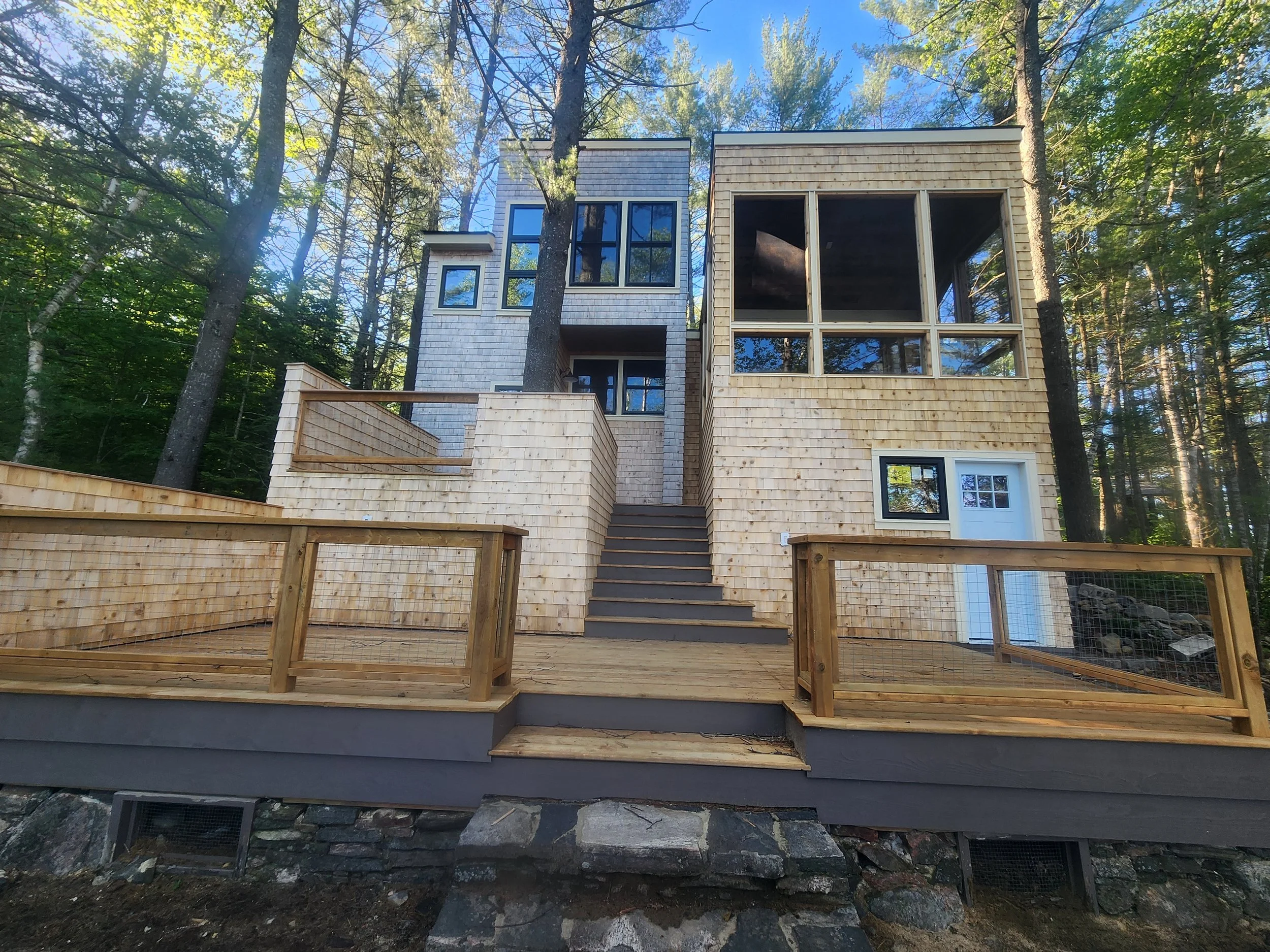ground-up-constructing-muskoka-cottage-deck-front-exterior.jpg