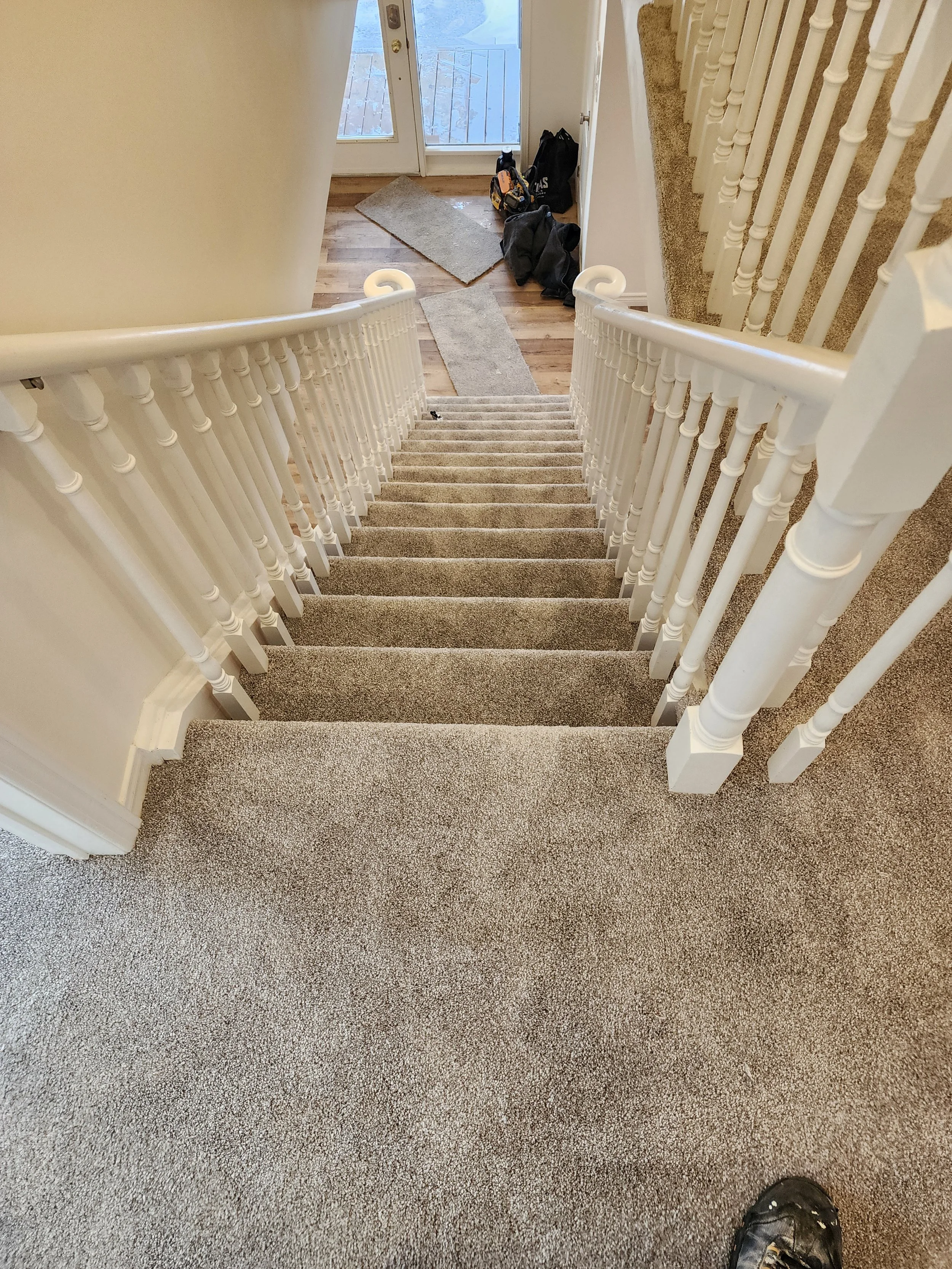 carpeted-staircase-white-railing-home-renovation-gravenhurst-muskoka-ontario.jpg