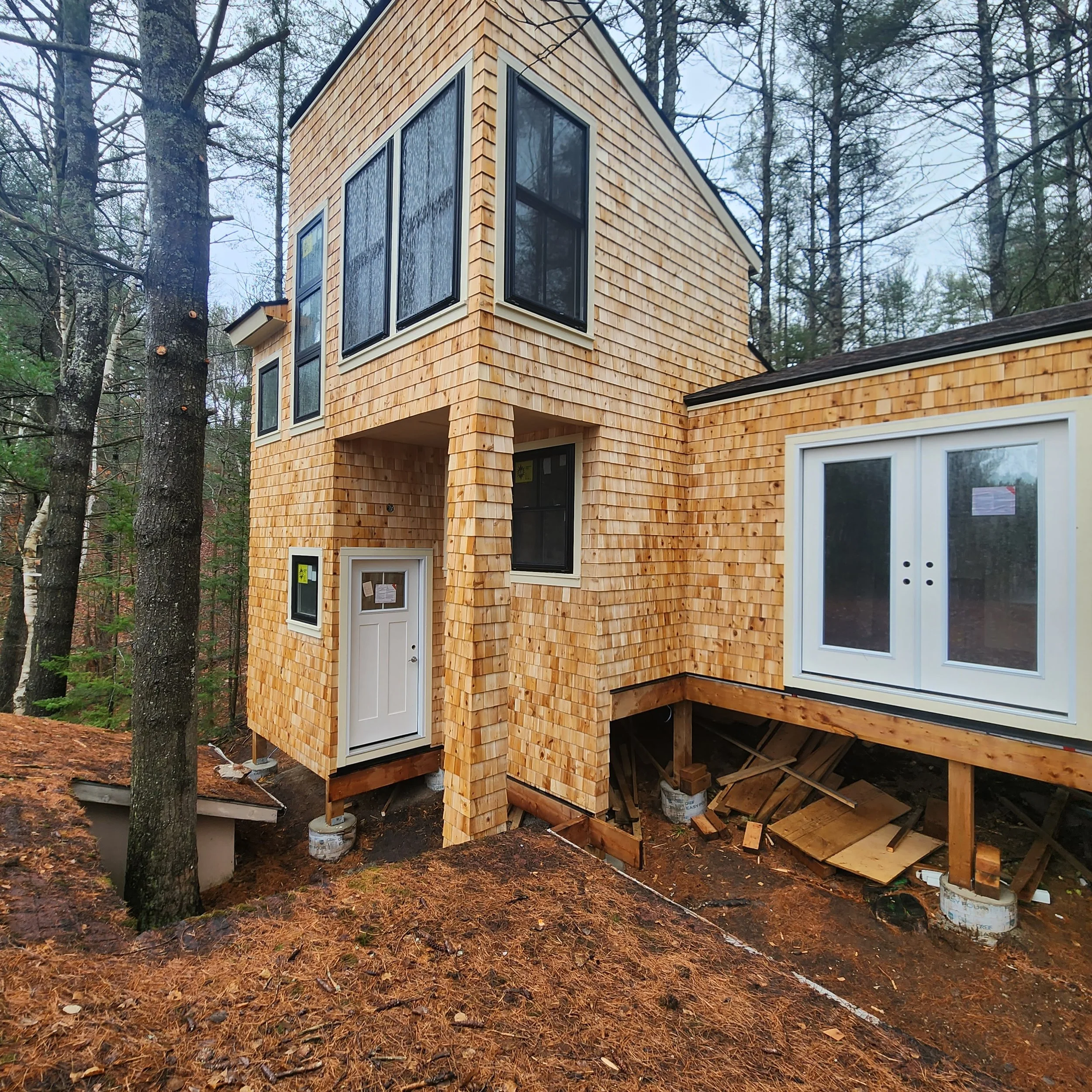custom-cottage-build-two-story-cedar-shingle-elevated-foundation-baysville-muskoka.jpg