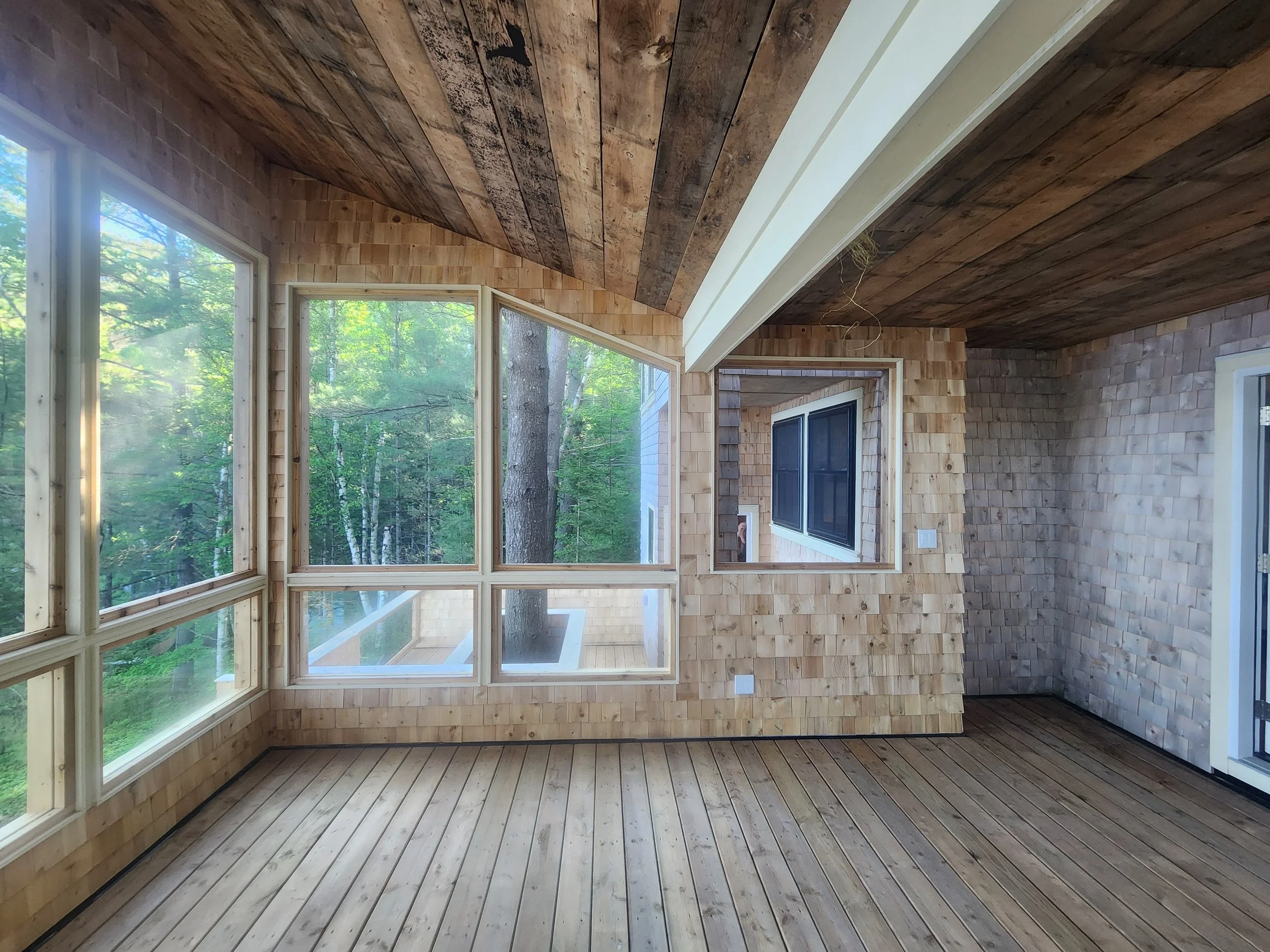 ground-up-constructing-muskoka-room-windows-forest-view.jpg