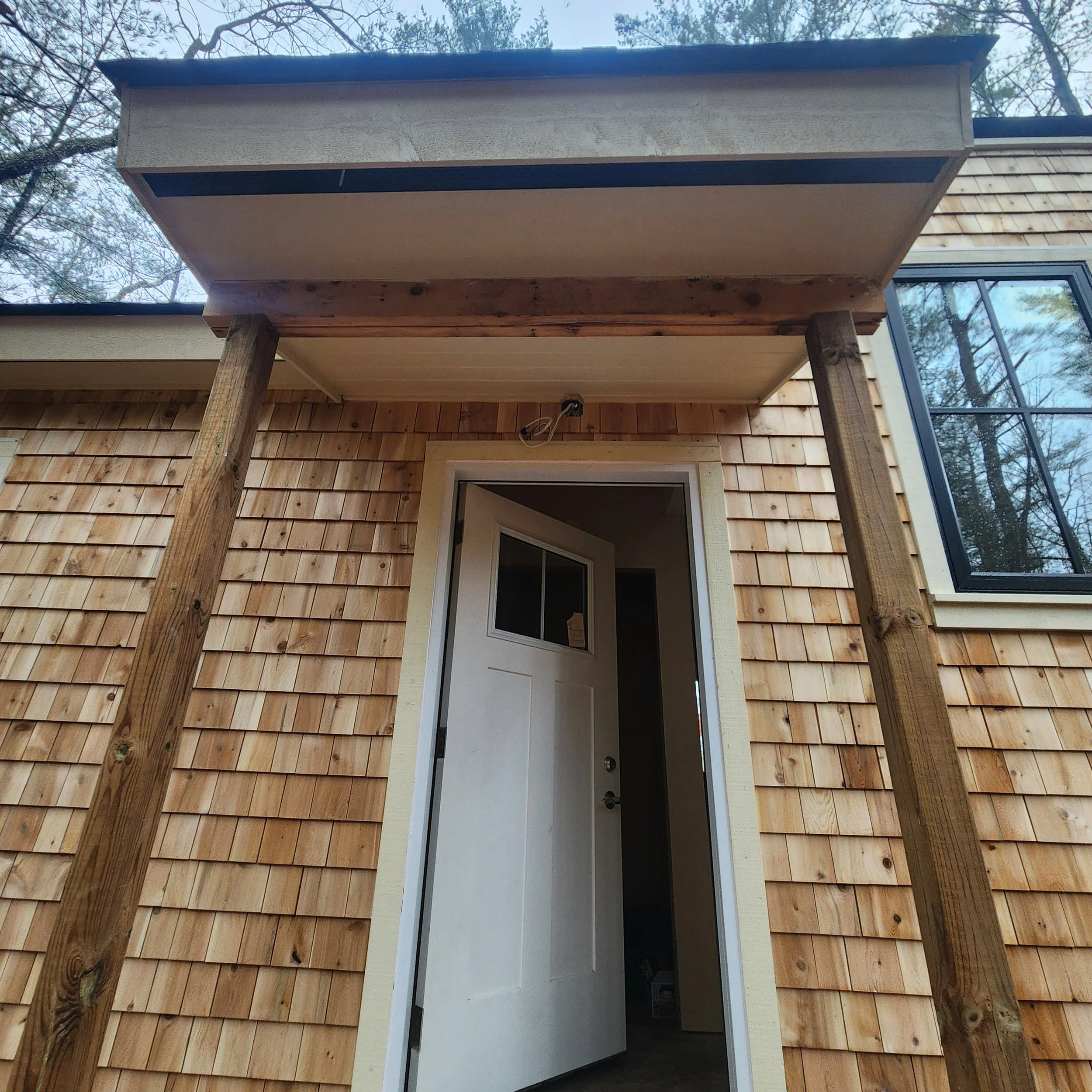 ground-up-constructing-muskoka-cottage-build-phase-1-entry-cedar-detail.jpg