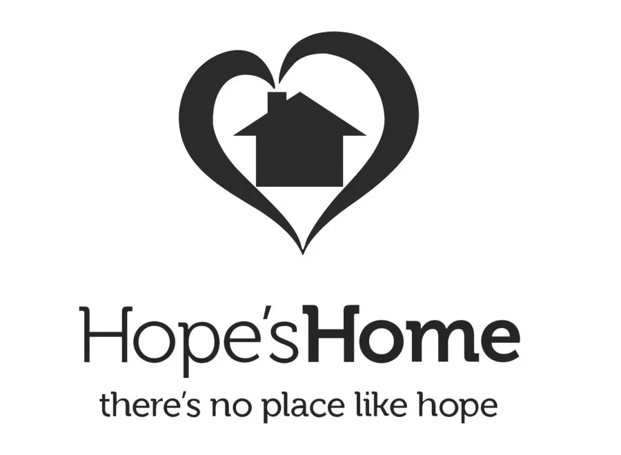 Logo of Hope's Home with a house inside a heart and tagline "there's no place like hope."
