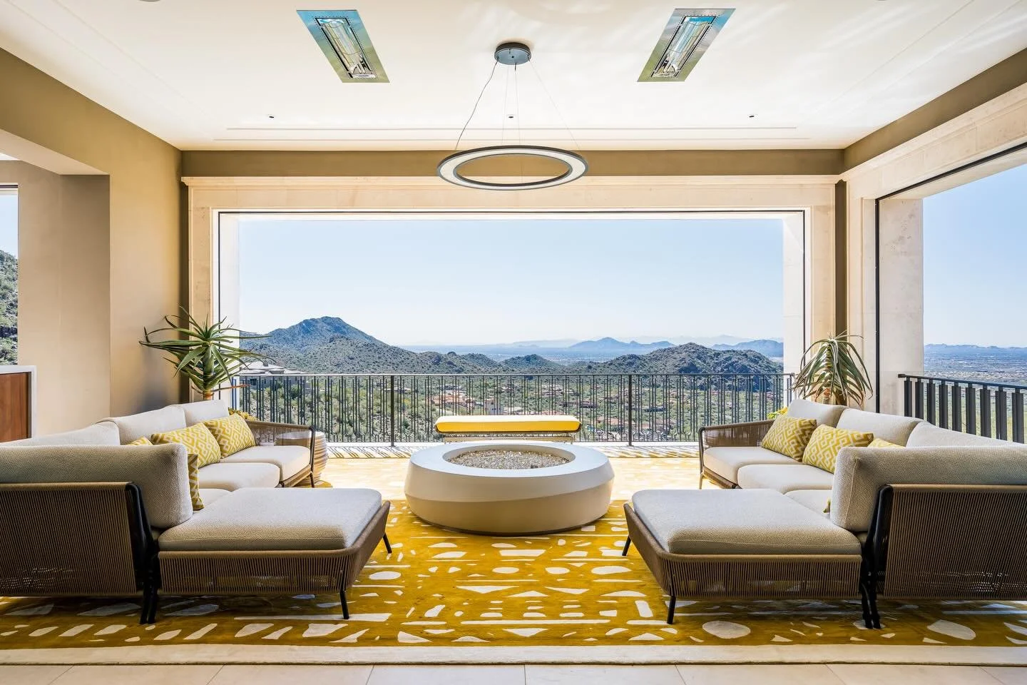 This irresistible indoor/outdoor terrace is sunny and inviting all times of day and night, with it&rsquo;s custom lighting beautifully complimenting the natural lighting. And that view! Those couches! Yes, please and thank you. 🤩

Builder: @salcitoc