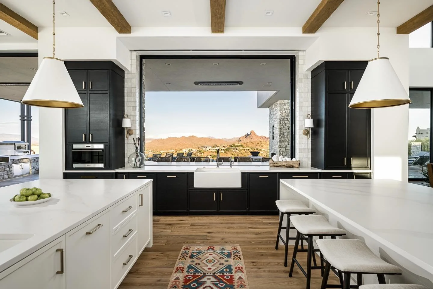 We&rsquo;re not sure if it&rsquo;s the lighting, the cabinetry, the layout, that view&hellip; or, more likely, the seamless blend of every thoughtful detail that makes this space one of our all-time favorites. ✨

Builder: @goldenheritagehomes  Custom
