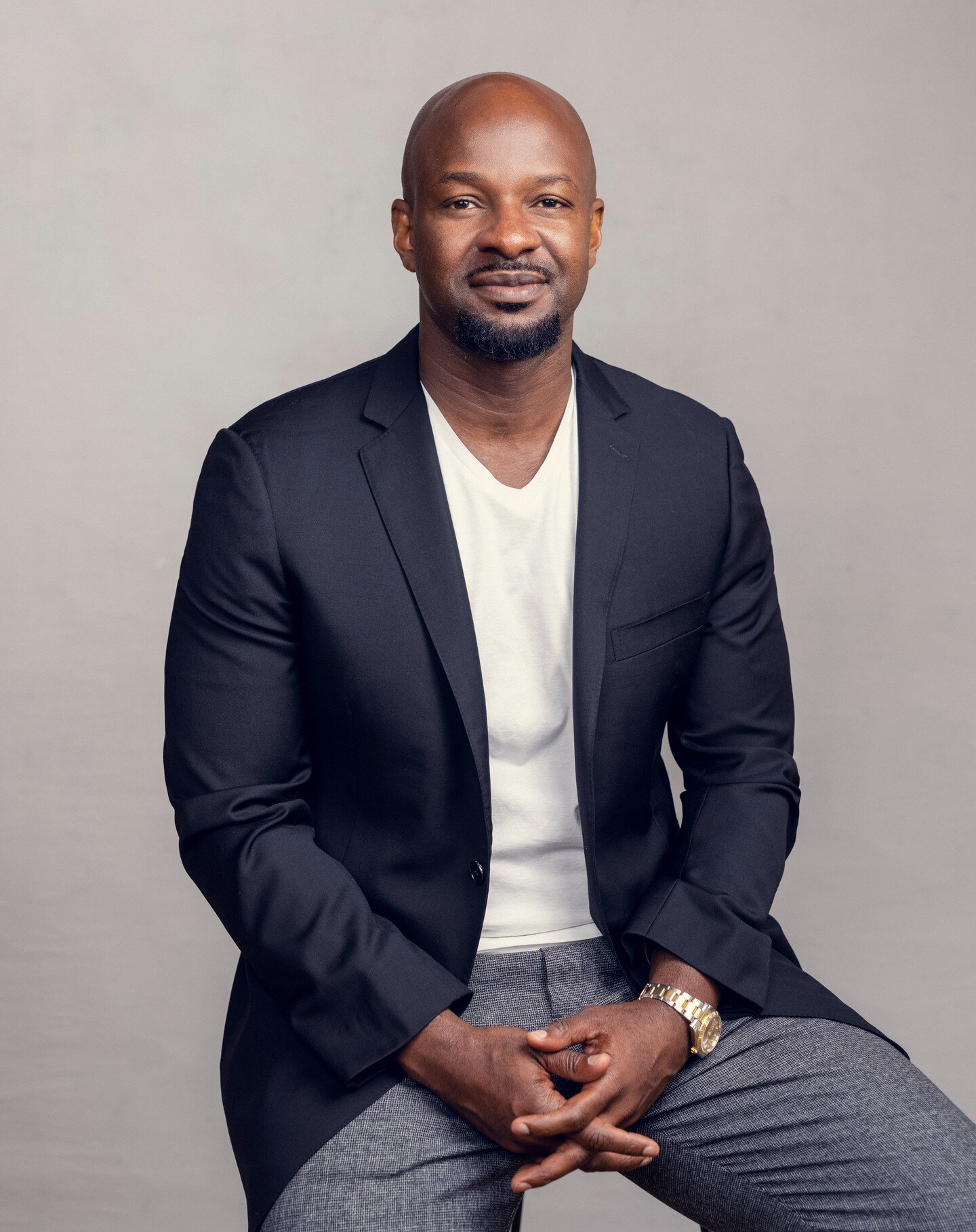 Here's Alex Okosi, MD of Emerging Markets at YouTube. He hired us to come to the YouTube offices in London back in 2021 to shoot some portraits of him. 
This is one of our favourite backdrops for corporate headshots. Grey is so much smarter than a wh