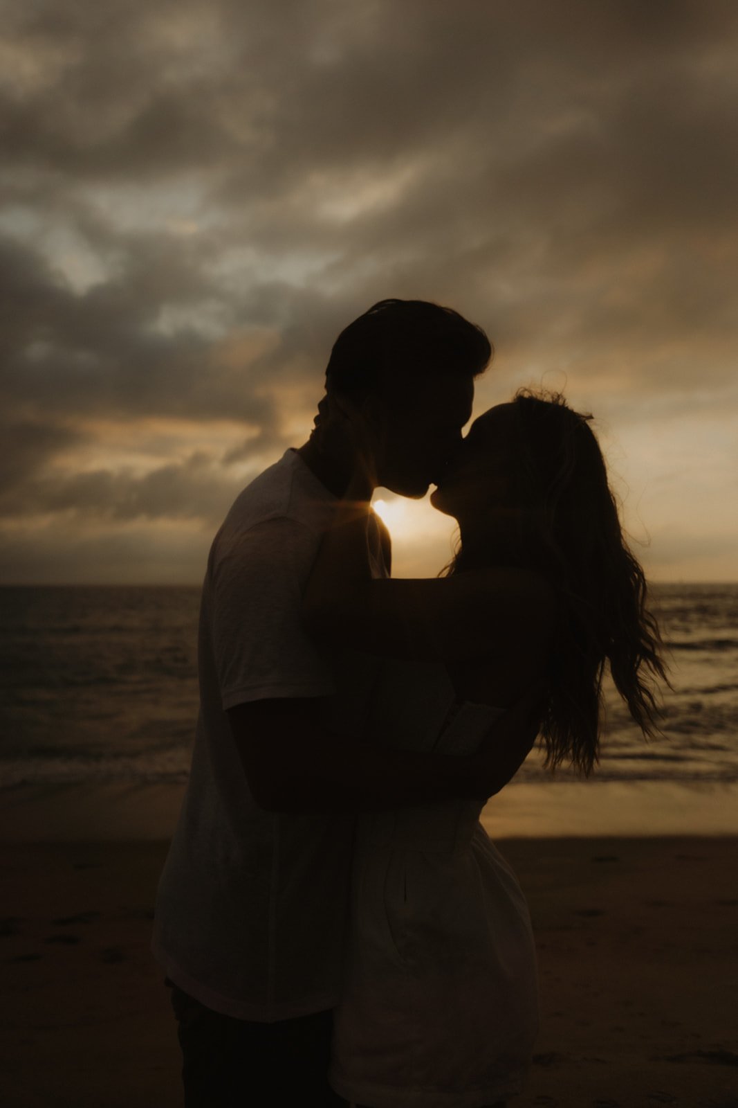 Silhouette of a couple kissing on the beach at sunset, Manhattan Beach Engagement Photography