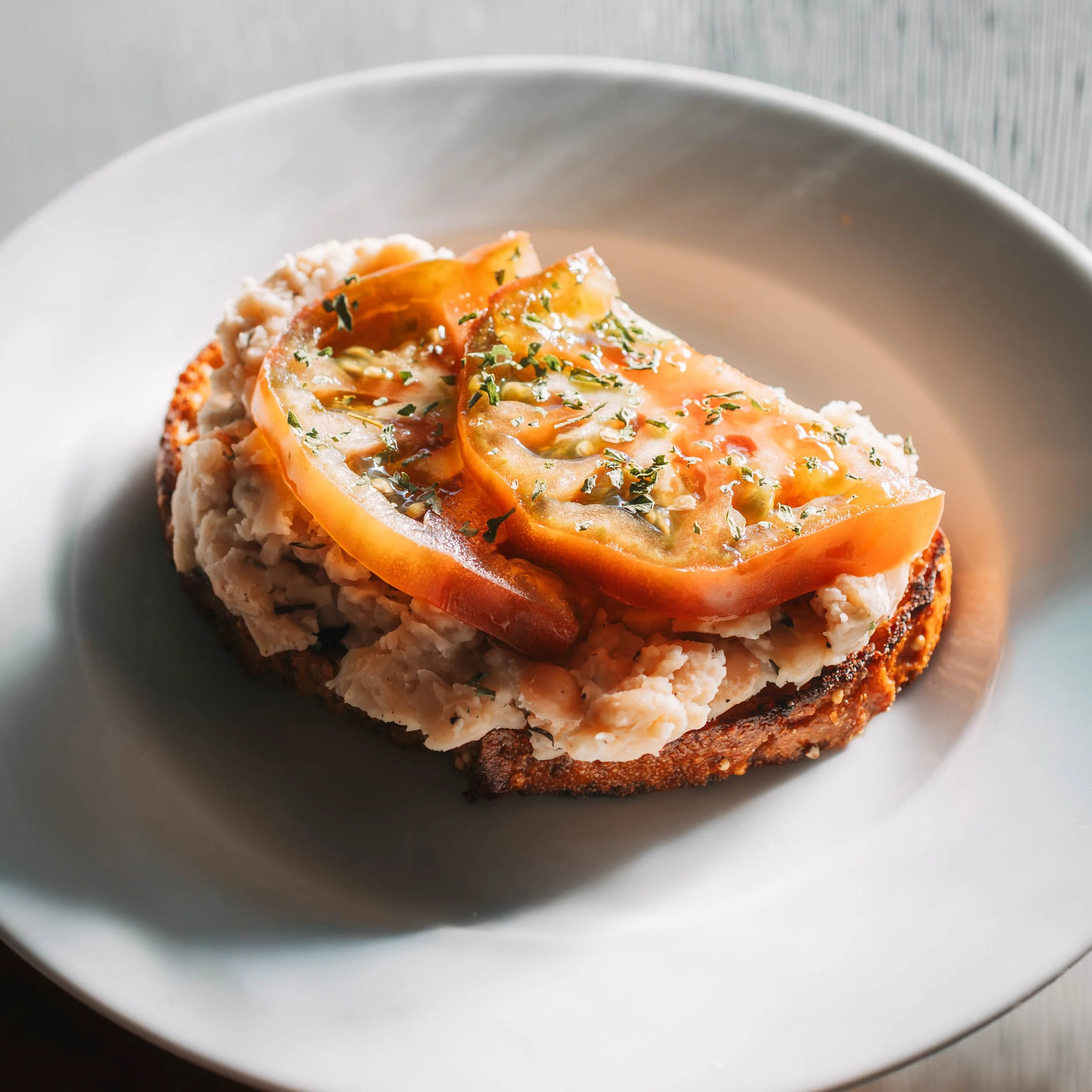 Whole Grain Toast with White Bean Mash and Tomato.jpeg