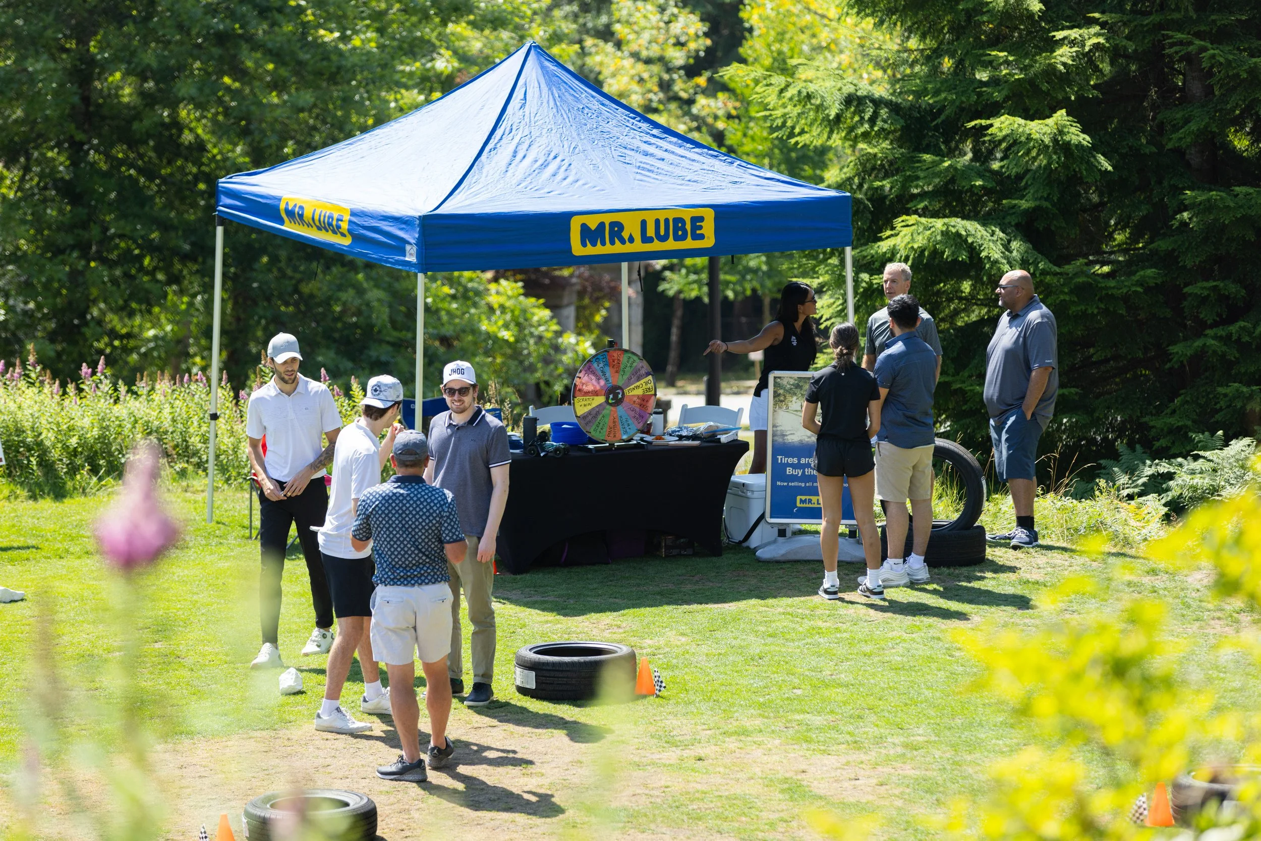 Attendees at an event play golf.