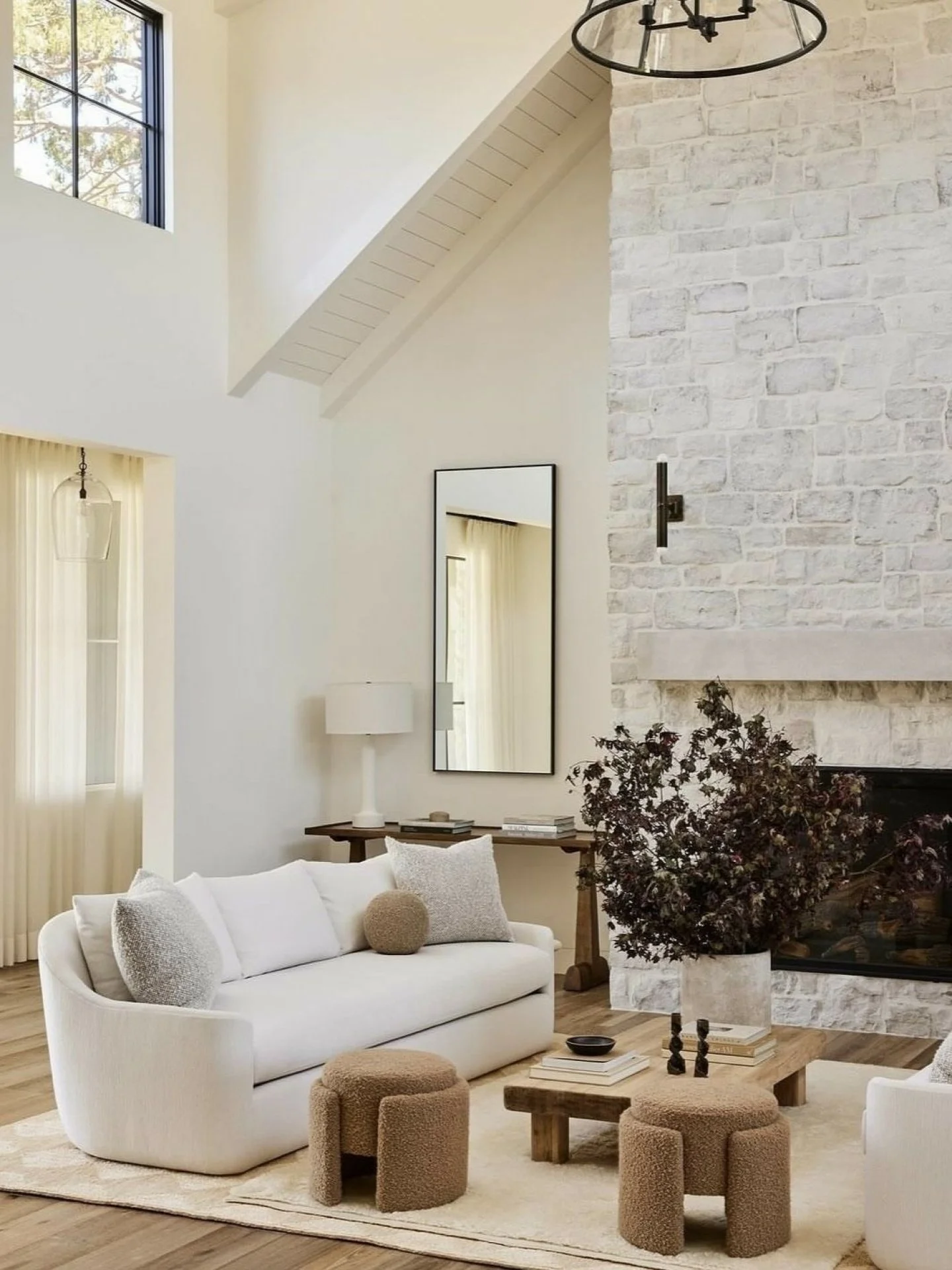 A moment of quiet luxury, anchored by timeless stone. 🤍

We&rsquo;re endlessly inspired by this softly layered living space, where the textured fireplace becomes the heart of the home. Warm neutrals, sculptural forms, and natural materials come toge