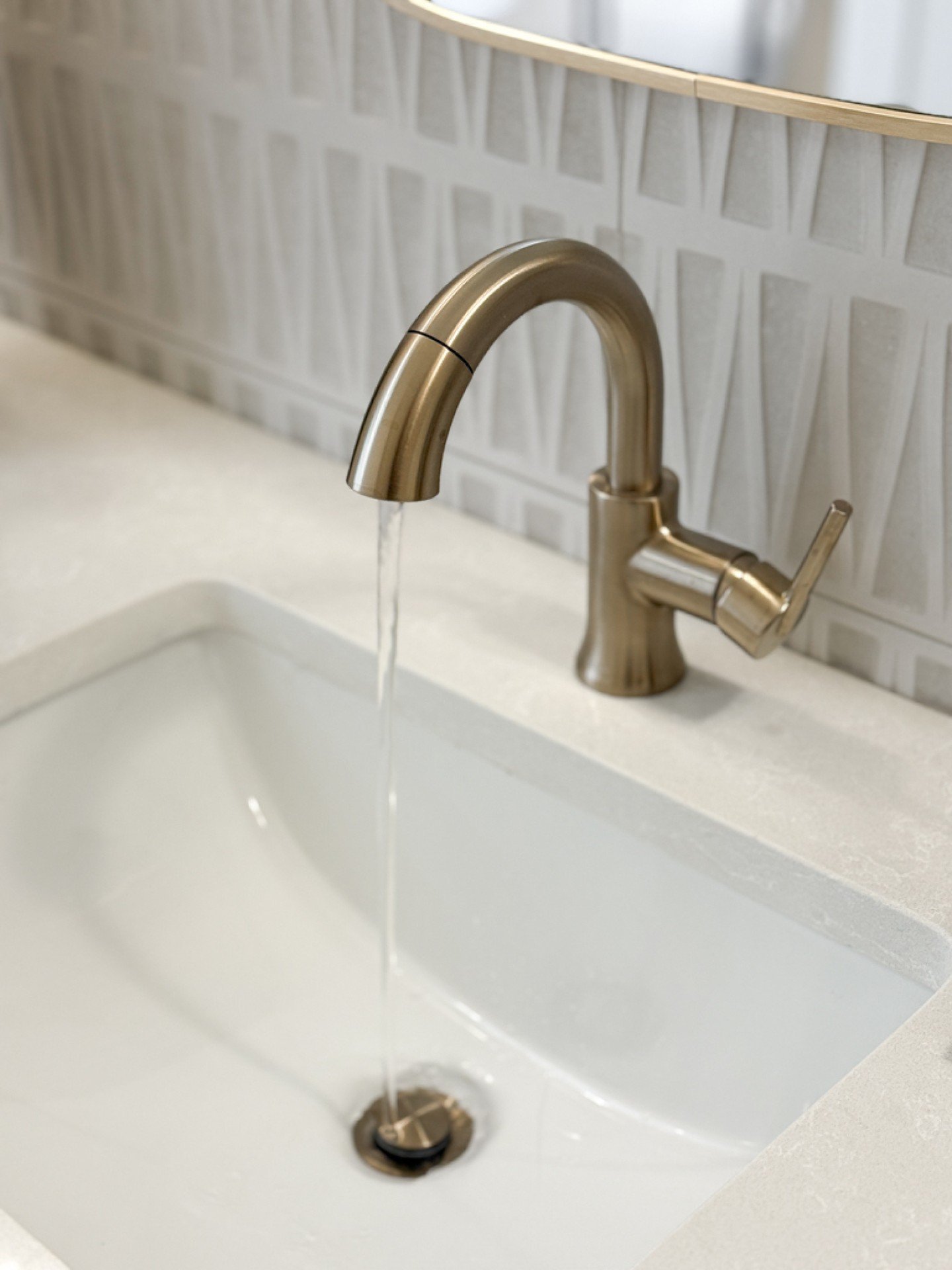 Every detail in the E19 triplex was designed to make a statement. 

The sculptural tile, warm brass fixtures, and softly layered textures come together to create a space that feels refined, elevated, and impossible to overlook. A perfect balance of b